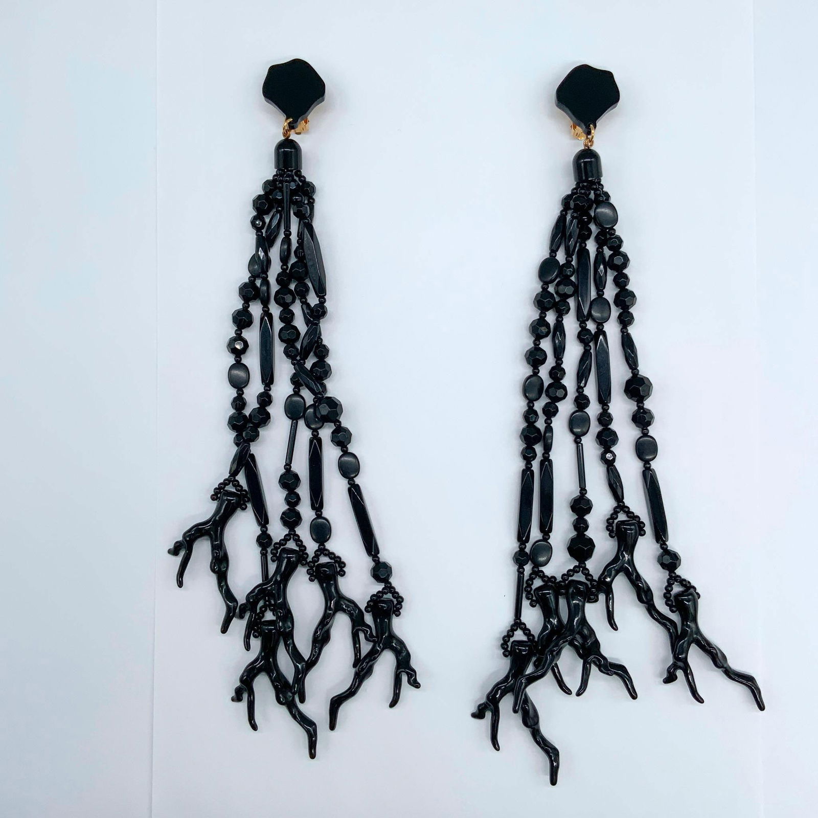 Clip-On Pendant Earrings with Black Coral, Onyx and Resin: Elegant and timeless, these handmade clip-on drop earrings feature a stunning design crafted with five black onyx and resin elements, beautifully finished with striking black coral accents that gracef