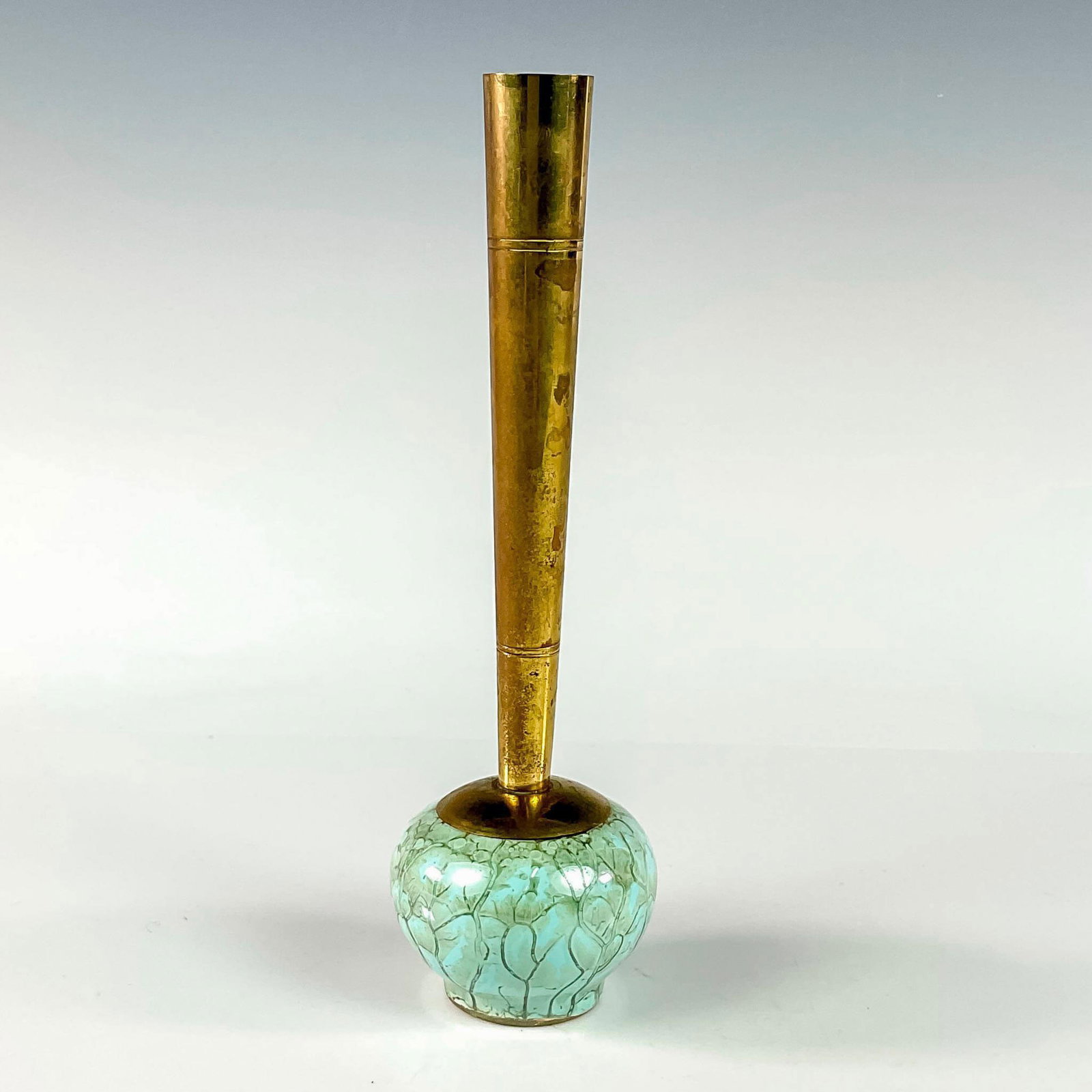Delft Mid-Century Modern Lustre Glaze Bud Vase: Turquoise with lustre finish and branch patterning. Round body. Narrow brass spout. Hand Painted Delft Holland on bottom. This item has no reserve. Dimensions: 2.25"W x 8"H Manufacturer: Delft Country