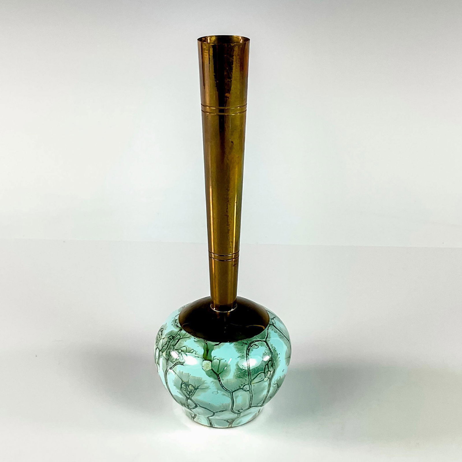 Delft Mid-Century Modern Lustre Glaze Bud Vase: Turquoise with lustre finish and branch patterning. Round body. Narrow brass spout. Hand Painted Delft Holland on bottom. This item has no reserve. Dimensions: 2.5"W x 6.75"H Manufacturer: Delft Count