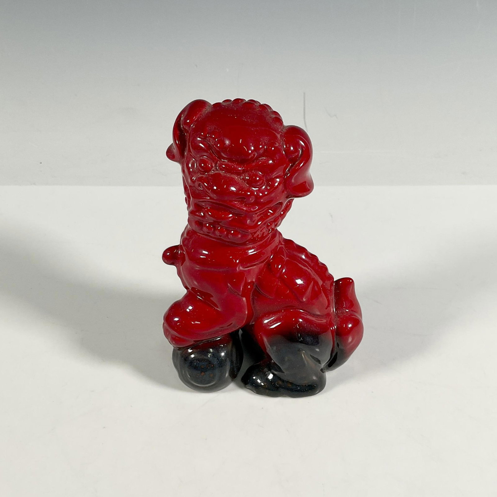 Dog of Fo - Royal Doulton Flambe Figurine: Model No 2957, part of the RDICC series. Foo dogs or lion dogs are Chinese guardian lions traditional seen as Chinese architectural ornament as the protectors. The lions are normally seen as pair; mal