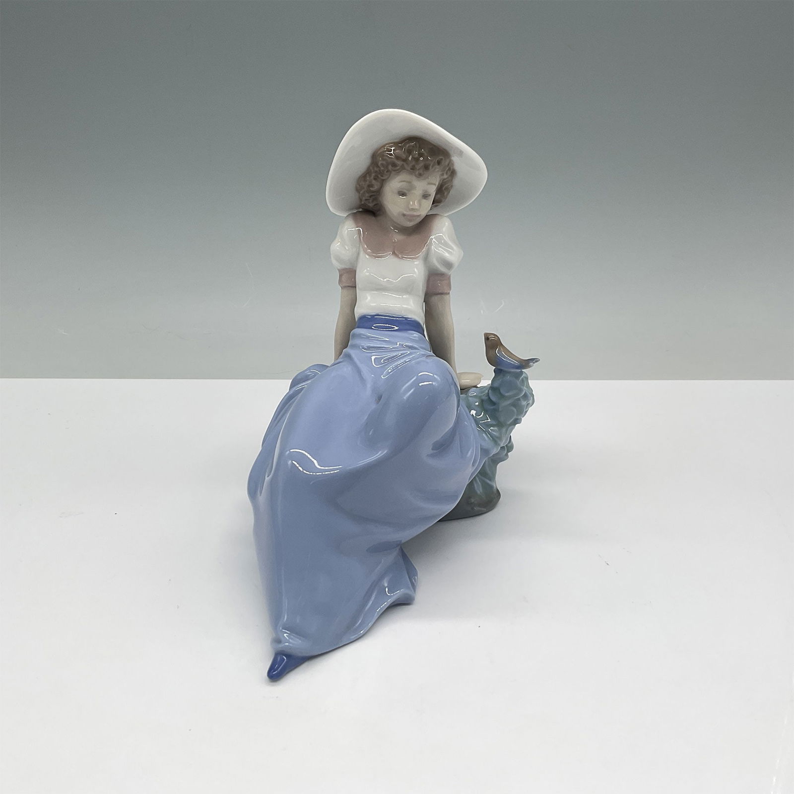 Nao by Lladro Porcelain Figurine, Girl Sitting w/Bird (1 of 3)