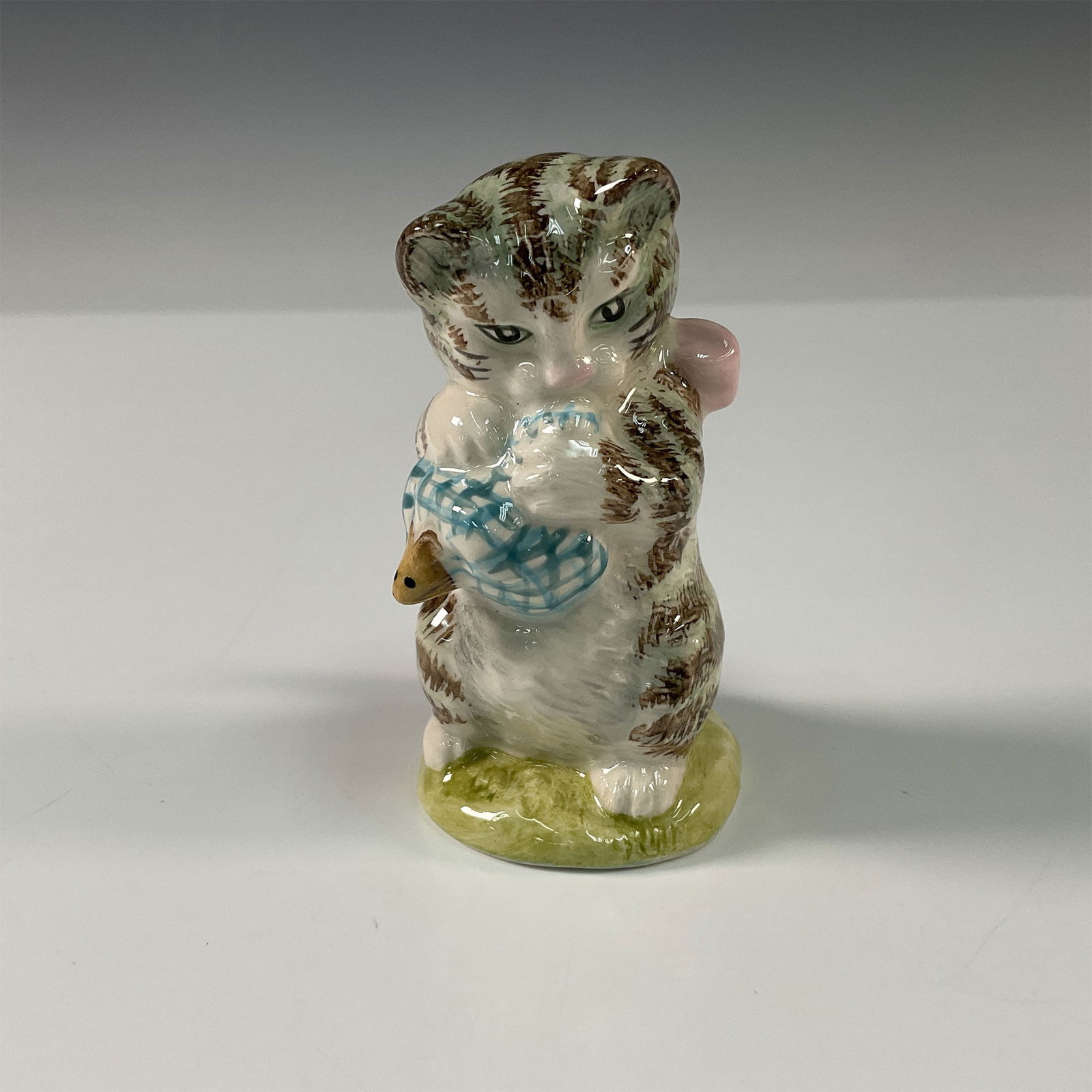 Beswick Beatrix Potter Figurine, Miss. Moppet: A charming vintage Beswick figurine depicting Miss Moppet, the playful kitten from Beatrix Potter's beloved children's stories. Crafted in England by Beswick, this ceramic figure features exquisite ha