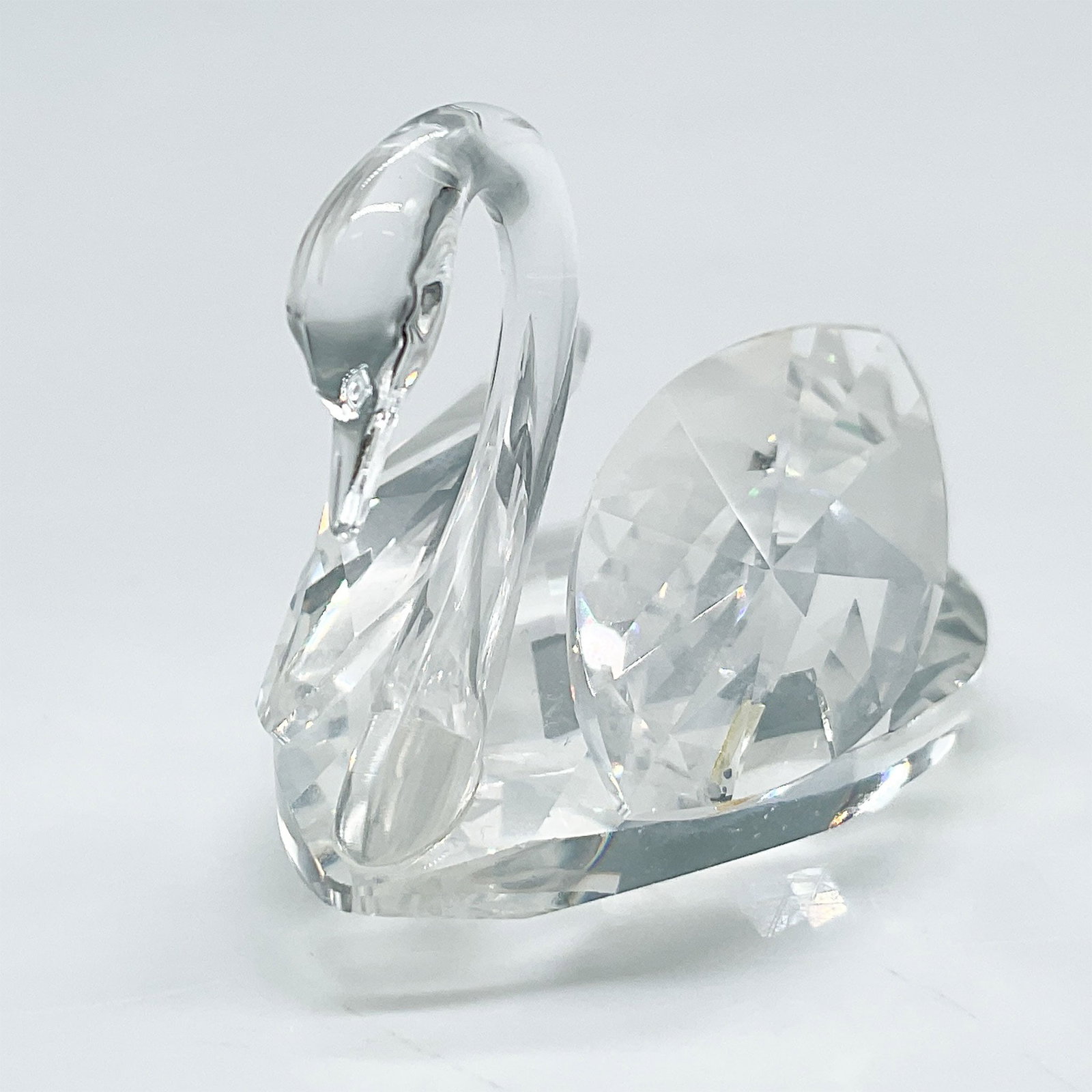 Swarovski Crystal Medium Swan Figurine with Original Box: Swarovski Silver Crystal medium swan figurine, featuring precision-cut clear crystal facets that beautifully capture and reflect light. Released as part of Swarovski's iconic crystal animal collection