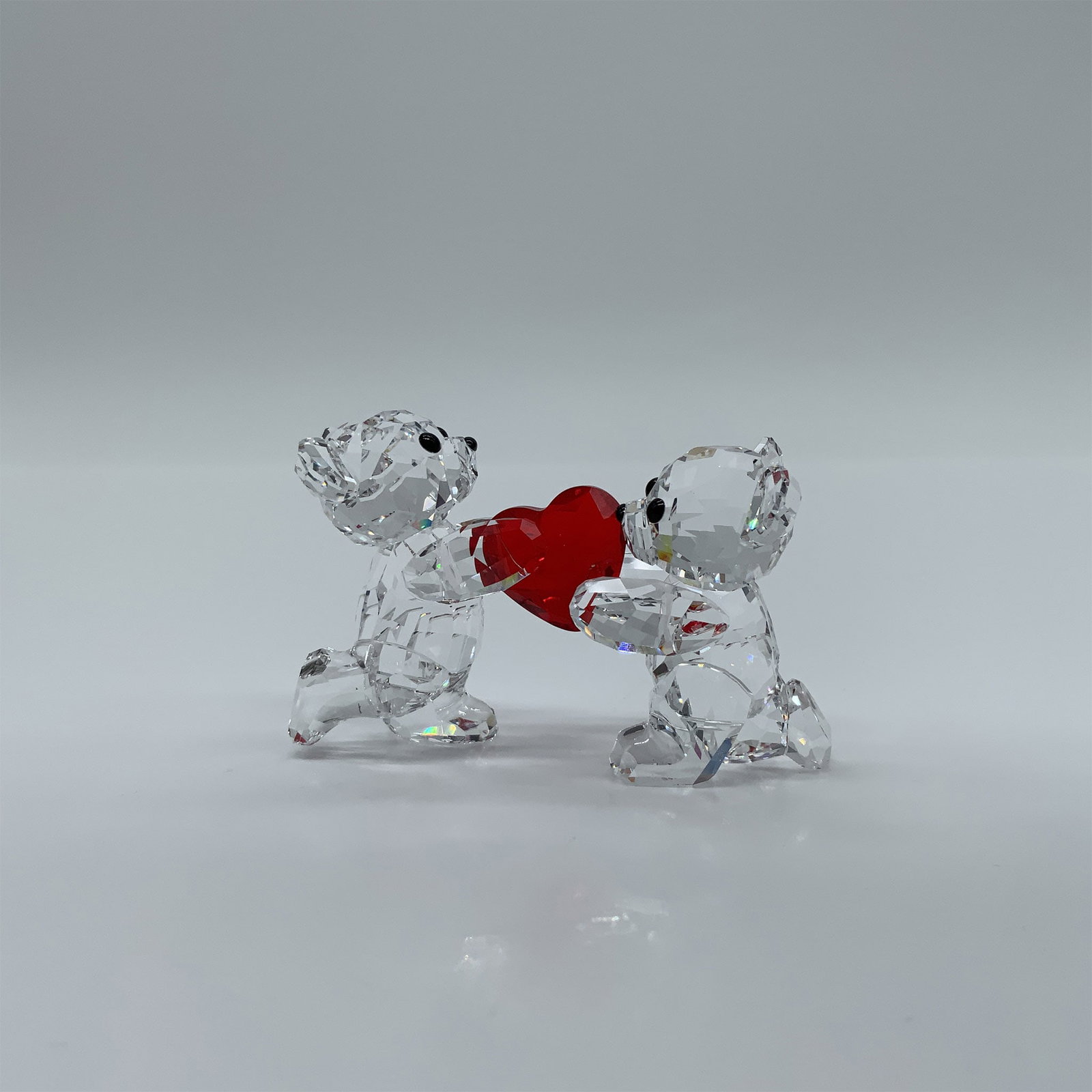Swarovski Figurine Kris Bear, My Heart Is Yours, 1143463: This charming pair of Kris Bears is the perfect romantic gesture for Valentine’s Day, an anniversary, or even as a wedding cake topper. Crafted in clear crystal, the bears are lovingly joined by a L