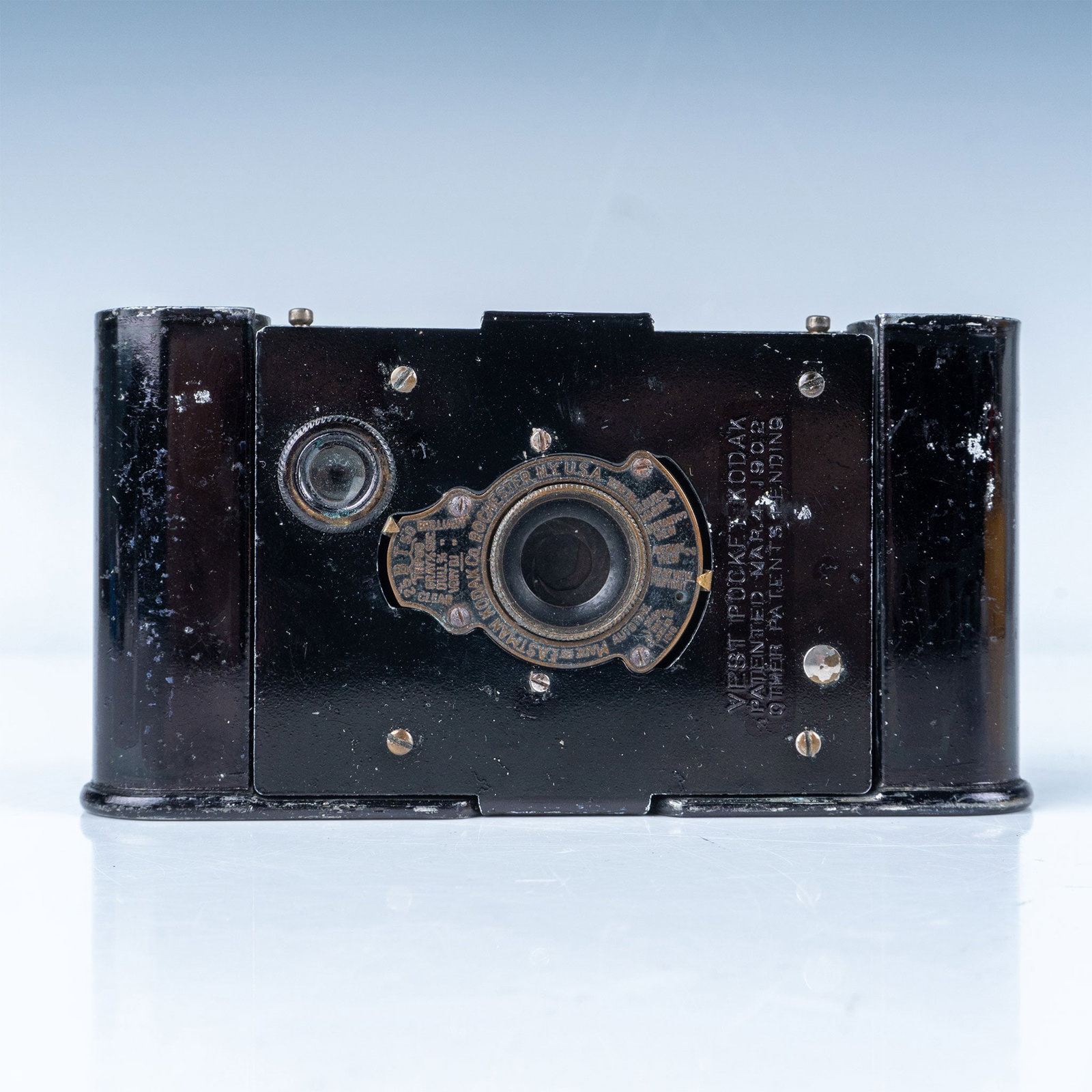 Eastman Kodak Vest Pocket Folding Camera, Model B: A vintage Eastman Kodak Vest Pocket Folding Camera, Model B, produced by the Eastman Kodak Company during the early 20th century. This compact camera features a folding bellows design and a metal body