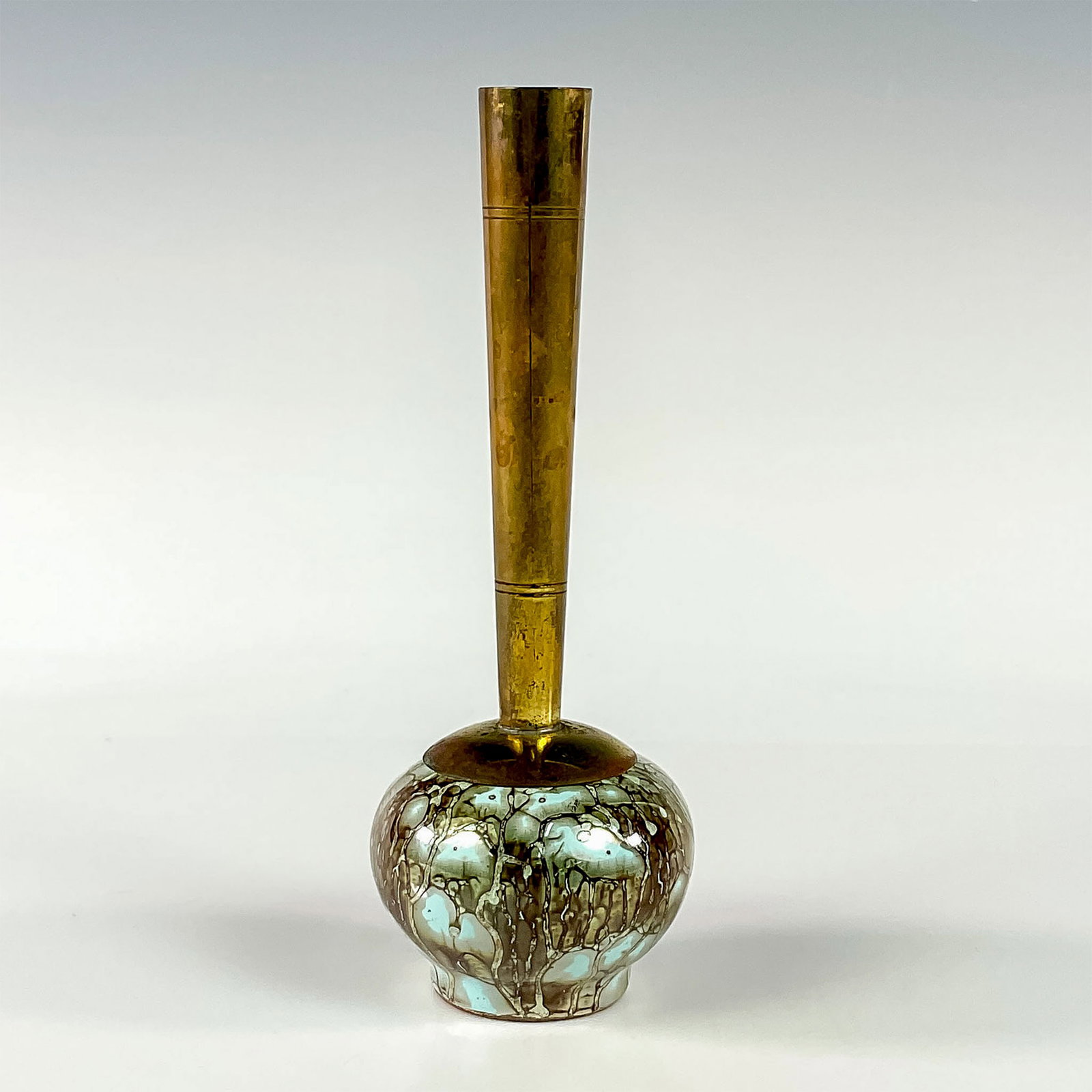 Delft Mid-Century Modern Lustre Glaze Bud Vase: Turquoise with lustre finish and branch patterning. Round body. Narrow brass spout. Hand Painted Delft Holland on bottom. This item has no reserve. Dimensions: 2.5"W x 6.75"H Country of Origin: Hollan