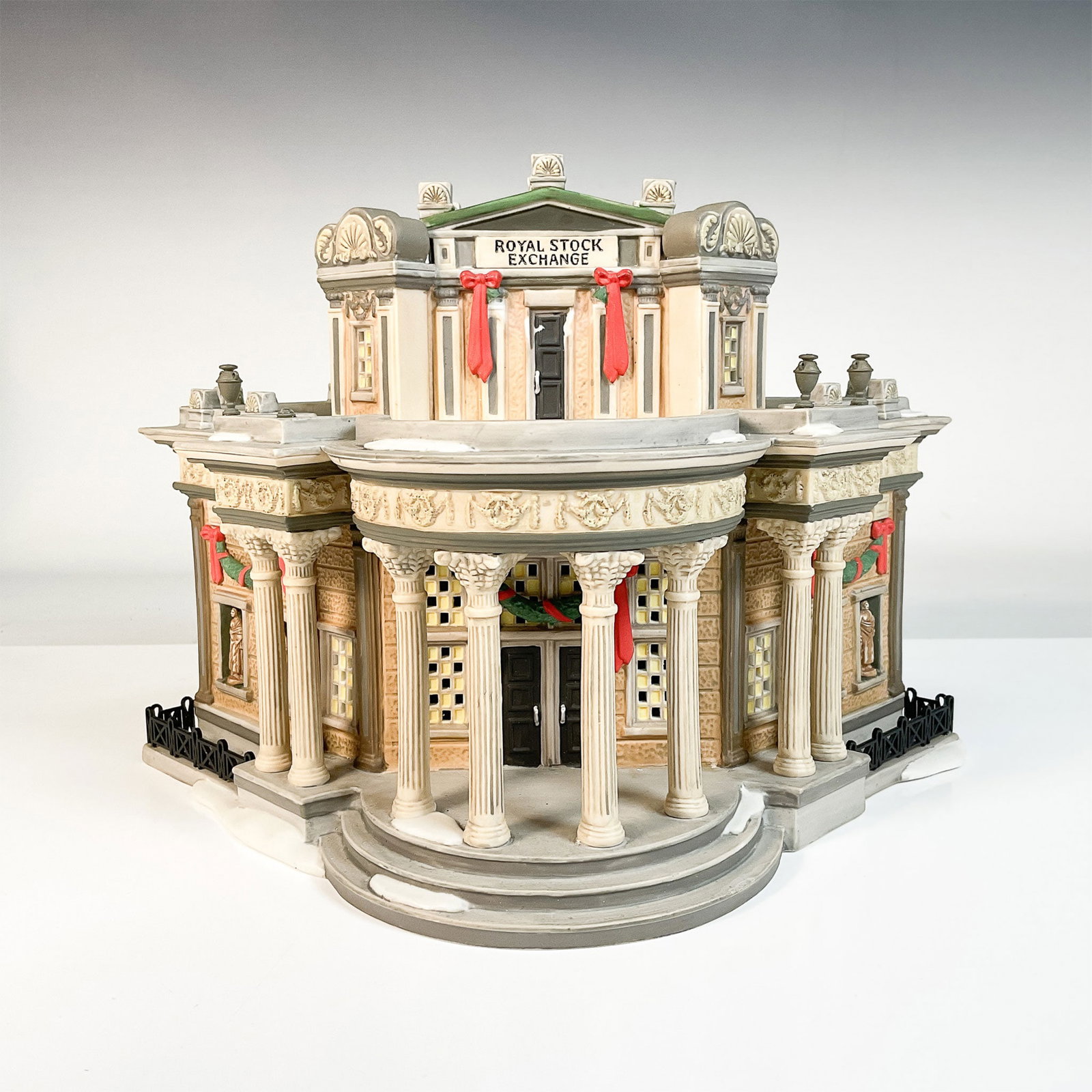 Dept 56 Dickens Village Royal Stock Exchange Figurine: The Royal Stock Exchange from the Dickens Village Series by Department 56 is an exceptional collectible. It depicts the iconic stock exchange building, adorned with festive holiday decorations, emphas