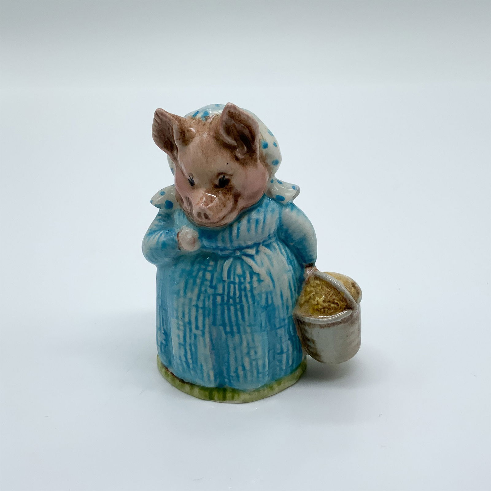 Beatrix Potter Porcelain Figurine, Aunt Pettitoes: Charming porcelain figurine depicting Aunt Pettitoes from the beloved Beatrix Potter series. Crafted with intricate detail, this piece captures the character's personality with delicate features and v