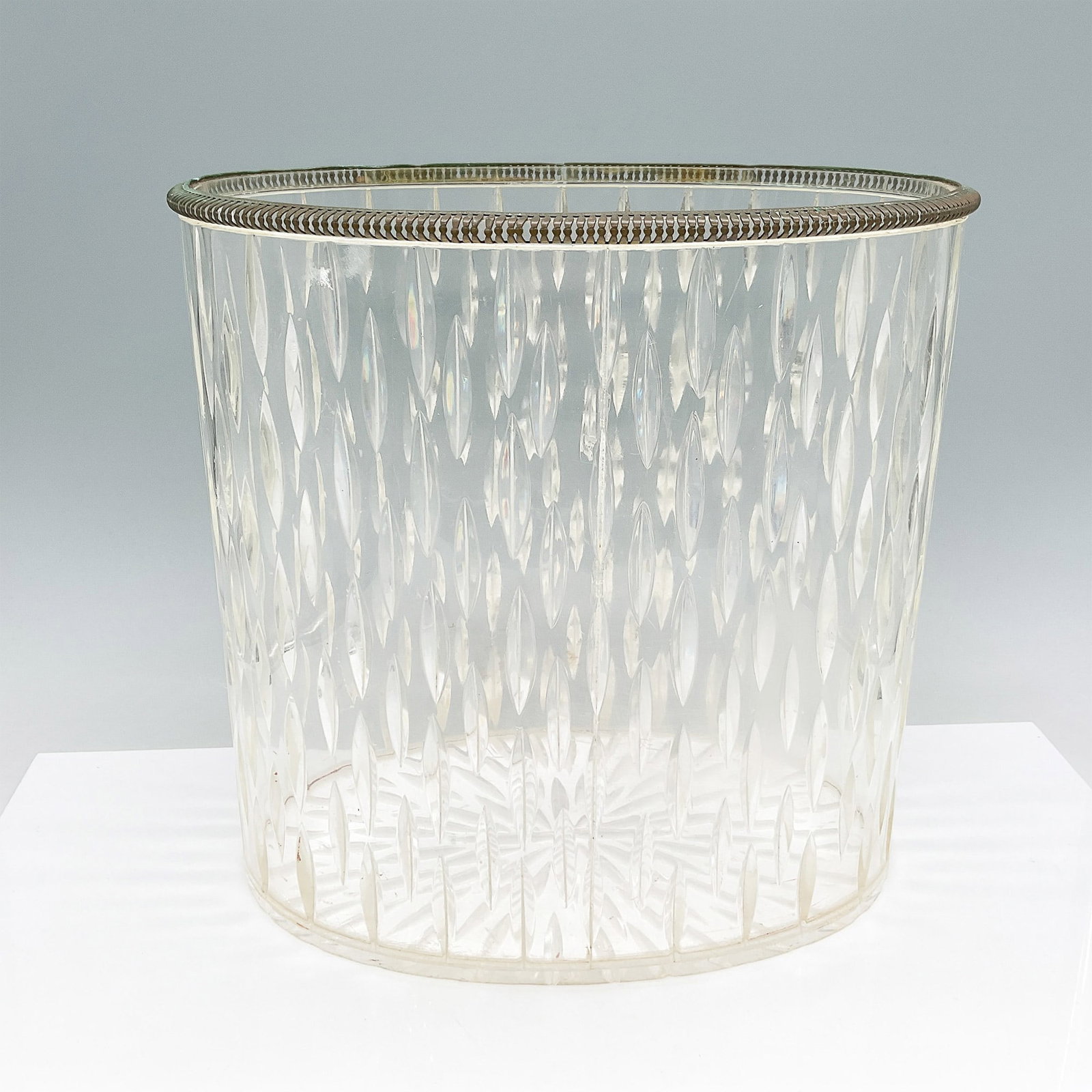 Mid Century Lucite Wastebasket with Diamond Pattern Design: A vintage Lucite wastebasket featuring a textured diamond pattern that adds a decorative touch. The translucent body is accented with a ribbed rim, showcasing a stylish and functional design. Lightwei