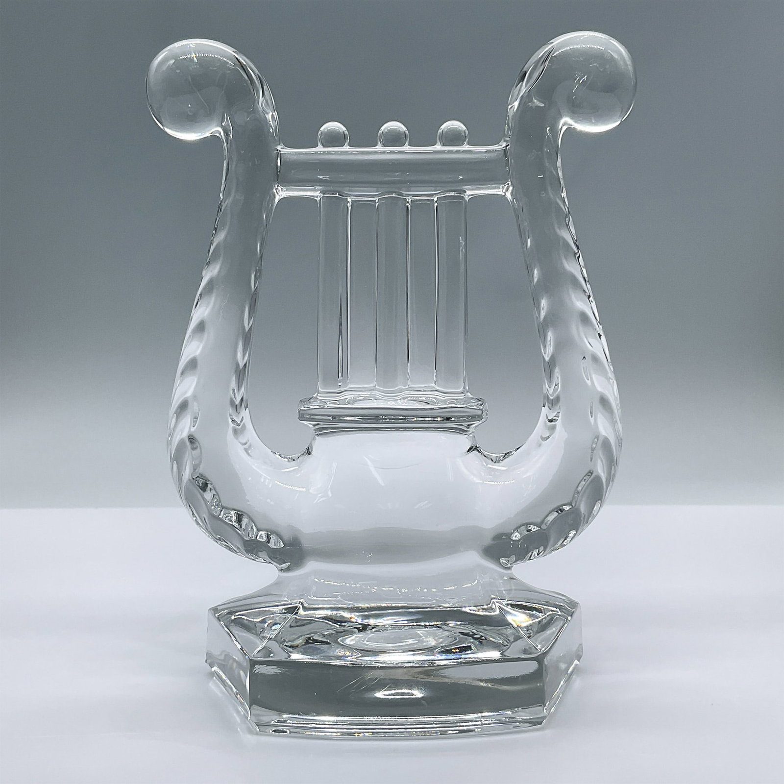 Vintage Clear Glass Lyre Bookend: This enchanting bookend is reminiscent of Fostoria glass. Issued: 20th century Dimensions: 5.5"L x 3"W x 7.75"H