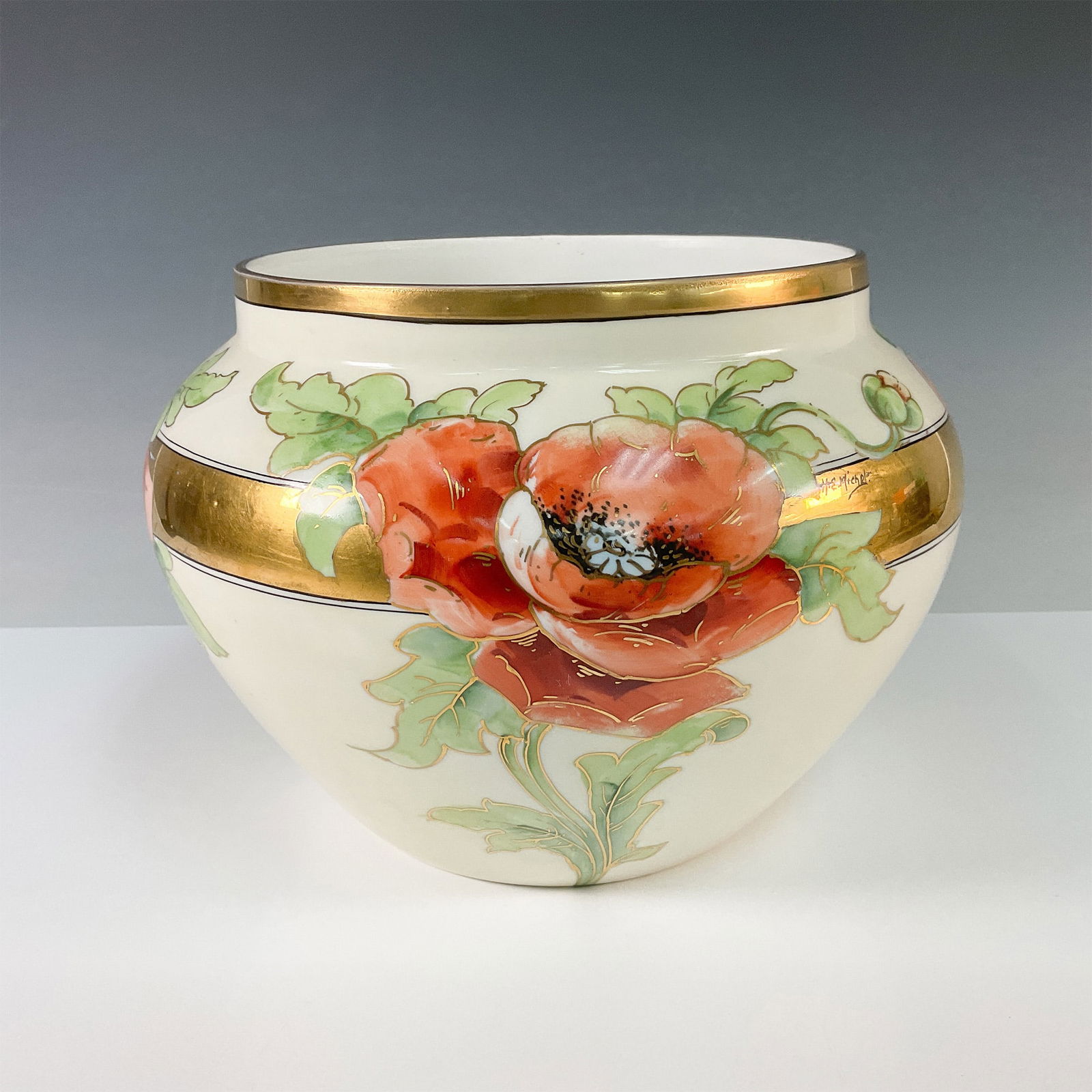 Bernardaud & Co. Porcelain Poppy Design Jardiniere: Beautiful Bernardaud & Co. porcelain jardiniere featuring an elegant hand painted poppy motif. The bold orange and red poppies with lush green foliage are accented by a gold band encircling the piece,