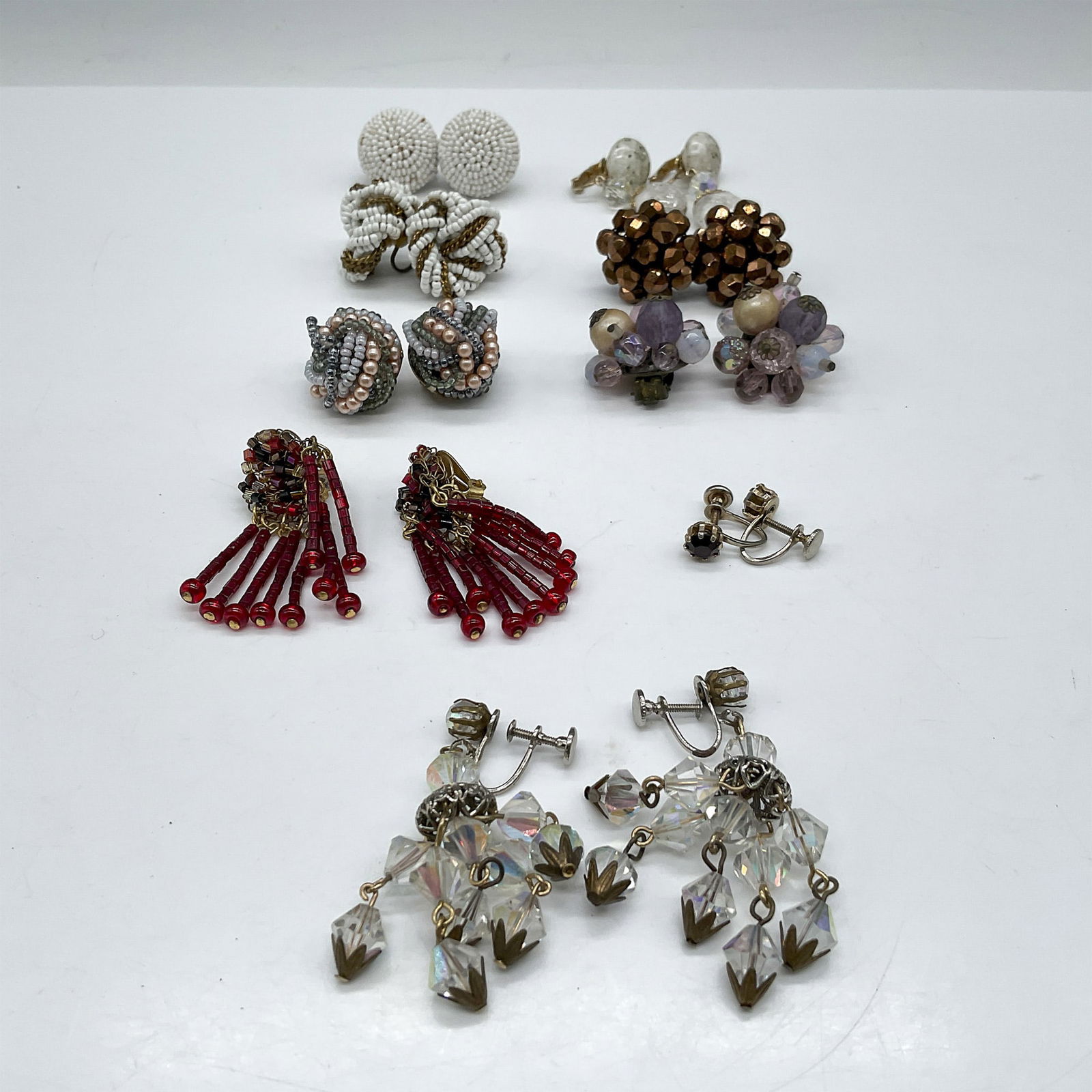9pc Beaded Costume Jewelry Earrings, Clip & Screw Backs: Colorful group of earrings including dangles, round clip and screw back post. Largest piece: 1.75"L x 1"W. Issued: 20th century Dimensions: See Description
