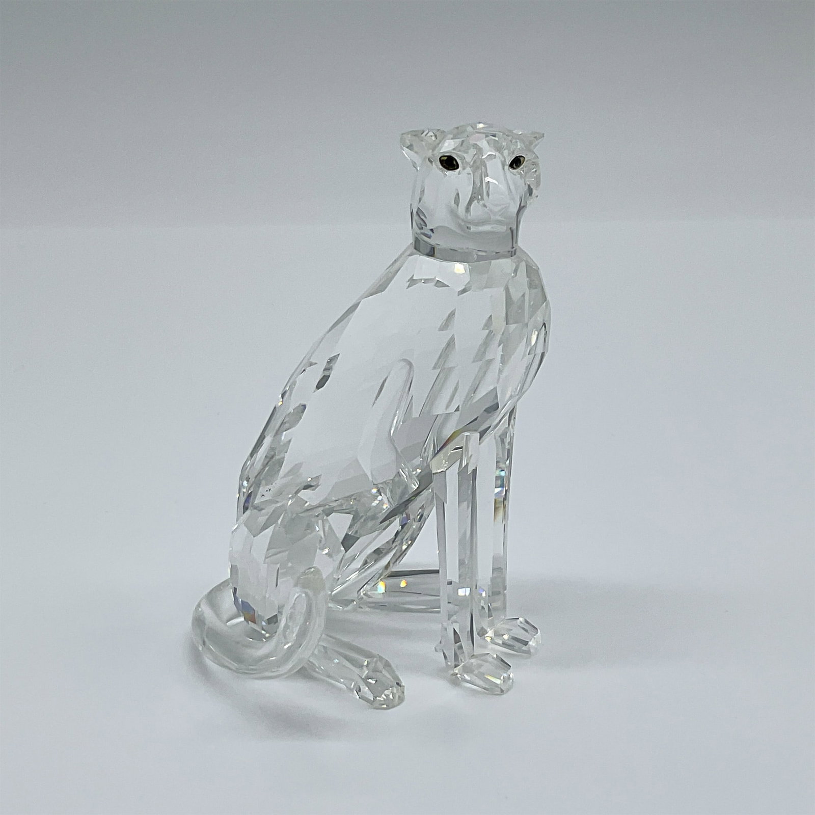Swarovski Cheetah High Tail 183225: This auction features the elegant Swarovski Cheetah High Tail Figurine, item number 183225, a stunning representation of Swarovski?s artistry in precision-cut crystal. This piece is a part of Swarovsk