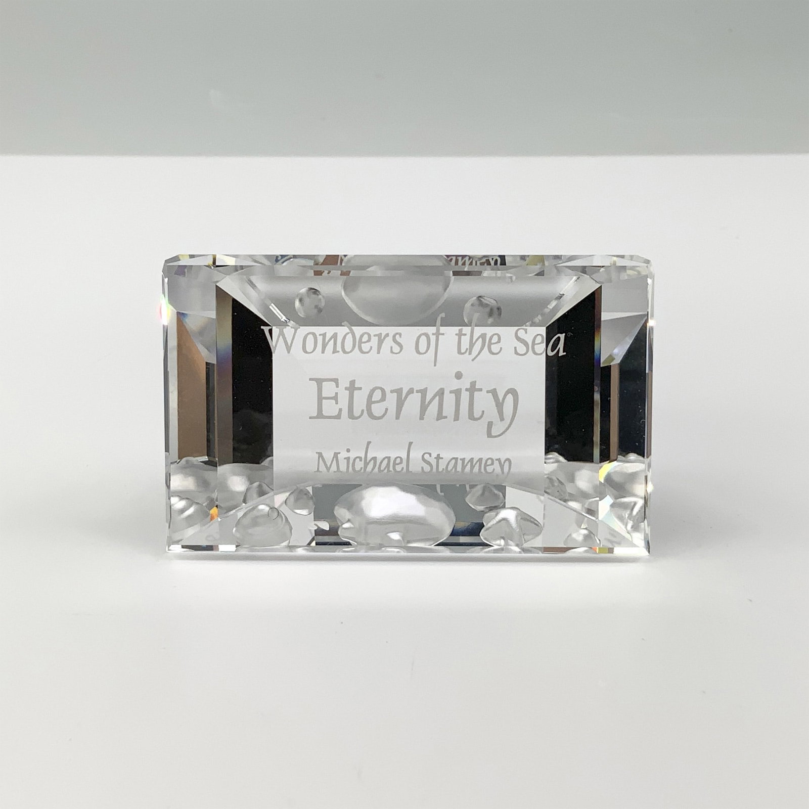 Swarovski Plaque, Wonders of the Sea Eternity: This Swarovski Wonders of the Sea "Eternity" title plaque was designed by Michael Stamey and introduced in 2006 as part of the "Wonders of the Sea" trilogy collection. Crafted from sparkling clear cry