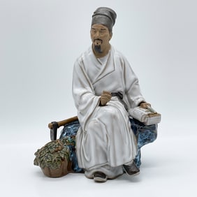 Chinese Porcelain Figurine of a Seated Scholar Mudman