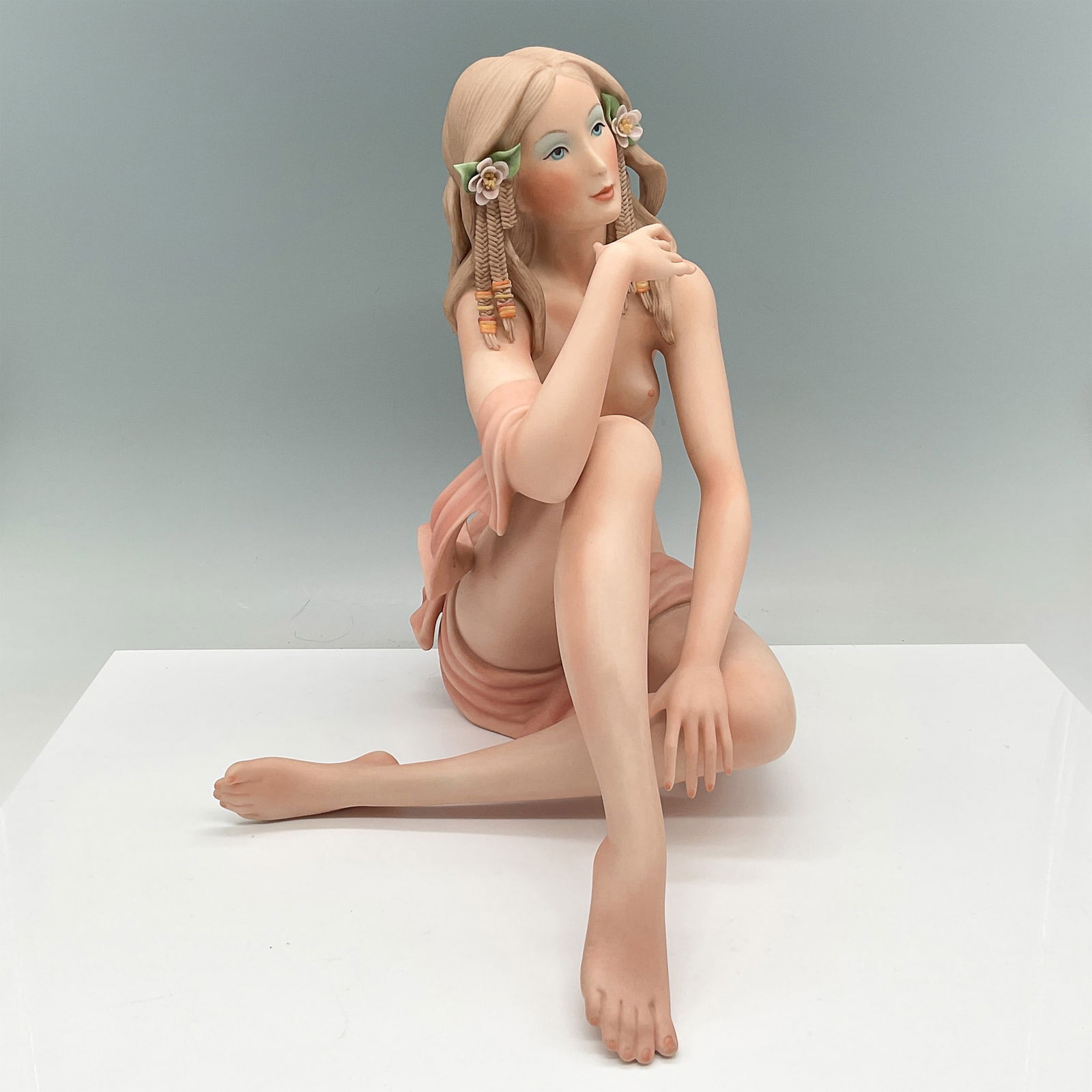 Goebel Porcelain Figurine Perfection by Laszlo Ispanky: Goebel porcelain figurine titled Perfection by renowned sculptor Laszlo Ispanky. This exquisite, limited edition crafted sculpture features a seated nude woman with braided hair adorned with floral de