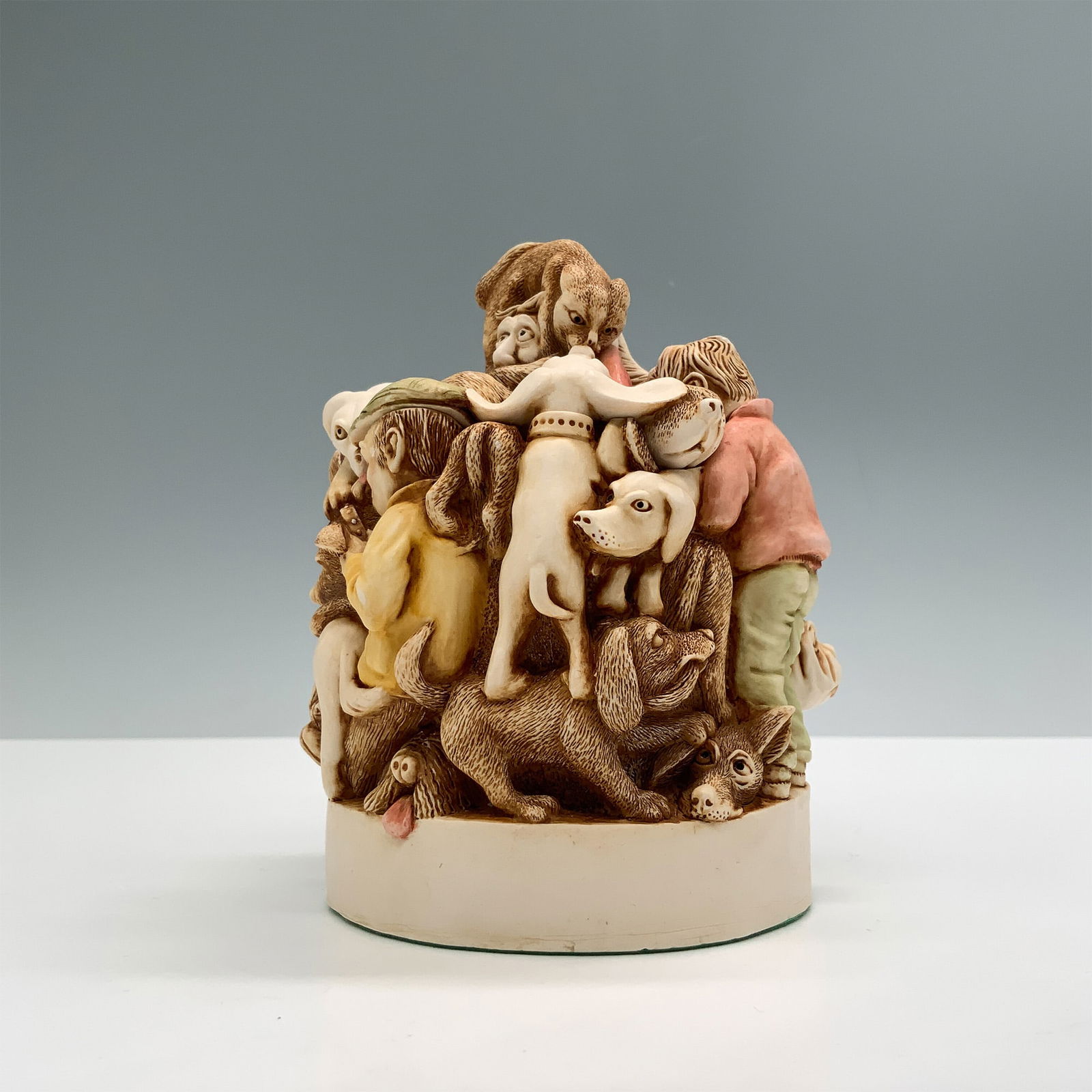 Harmony Kingdom Treasure Box, Mad Dogs and Englishmen, 1994: This Harmony Kingdom Treasure Box, titled "Mad Dogs and Englishmen," was crafted in 1994 in England. Designed with intricate detail, it features a humorous and chaotic depiction of dogs and humans ent