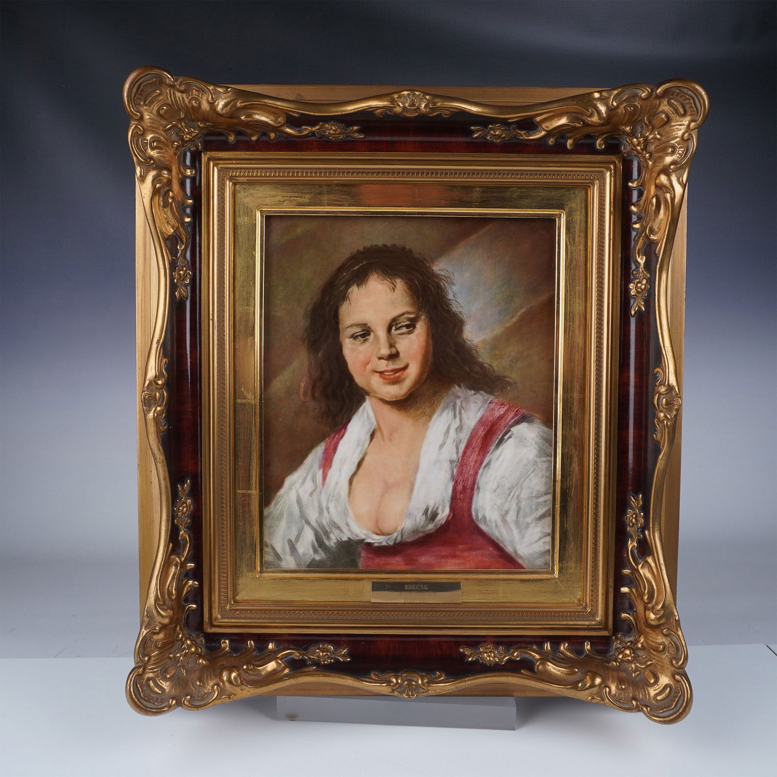 After Frans Hals (1582-1666) Rosenthal Plaque, Gypsy Girl: A finely crafted Rosenthal porcelain plaque featuring a detailed portrait of a gypsy girl, inspired by Frans Hals' renowned oil-on-wood painting created circa 1628-1630. This stunning reproduction cap