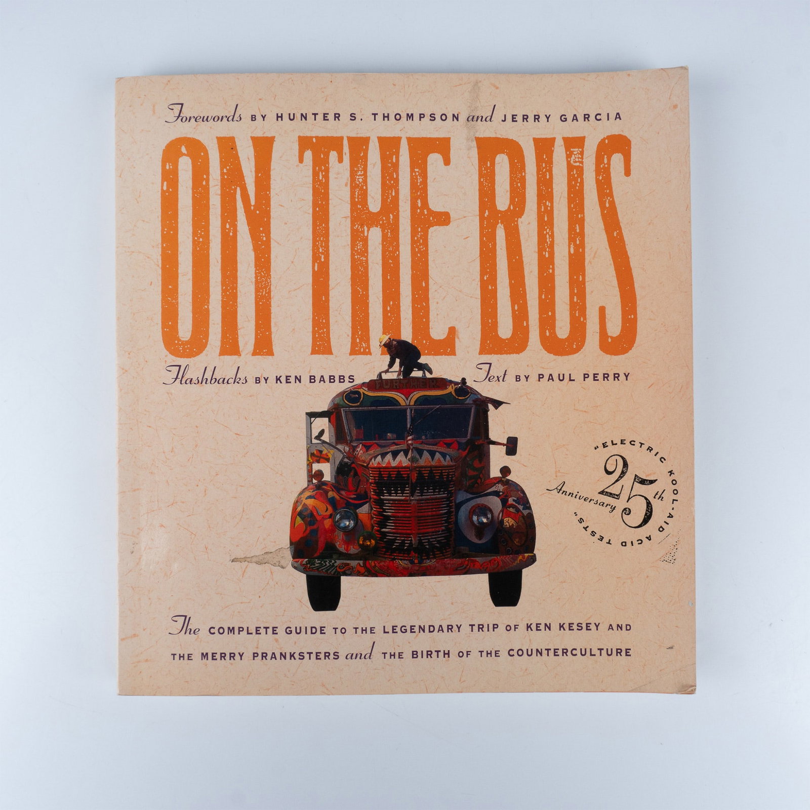 Paul Perry Softcover Book, On the Bus The Complete Guide: New York: Thunder's Mouth Press, 1991. A 195-page book offering a comprehensive exploration of the infamous cross-country journey taken by Ken Kesey and the Merry Pranksters in the 1960s. ISBN: 093841
