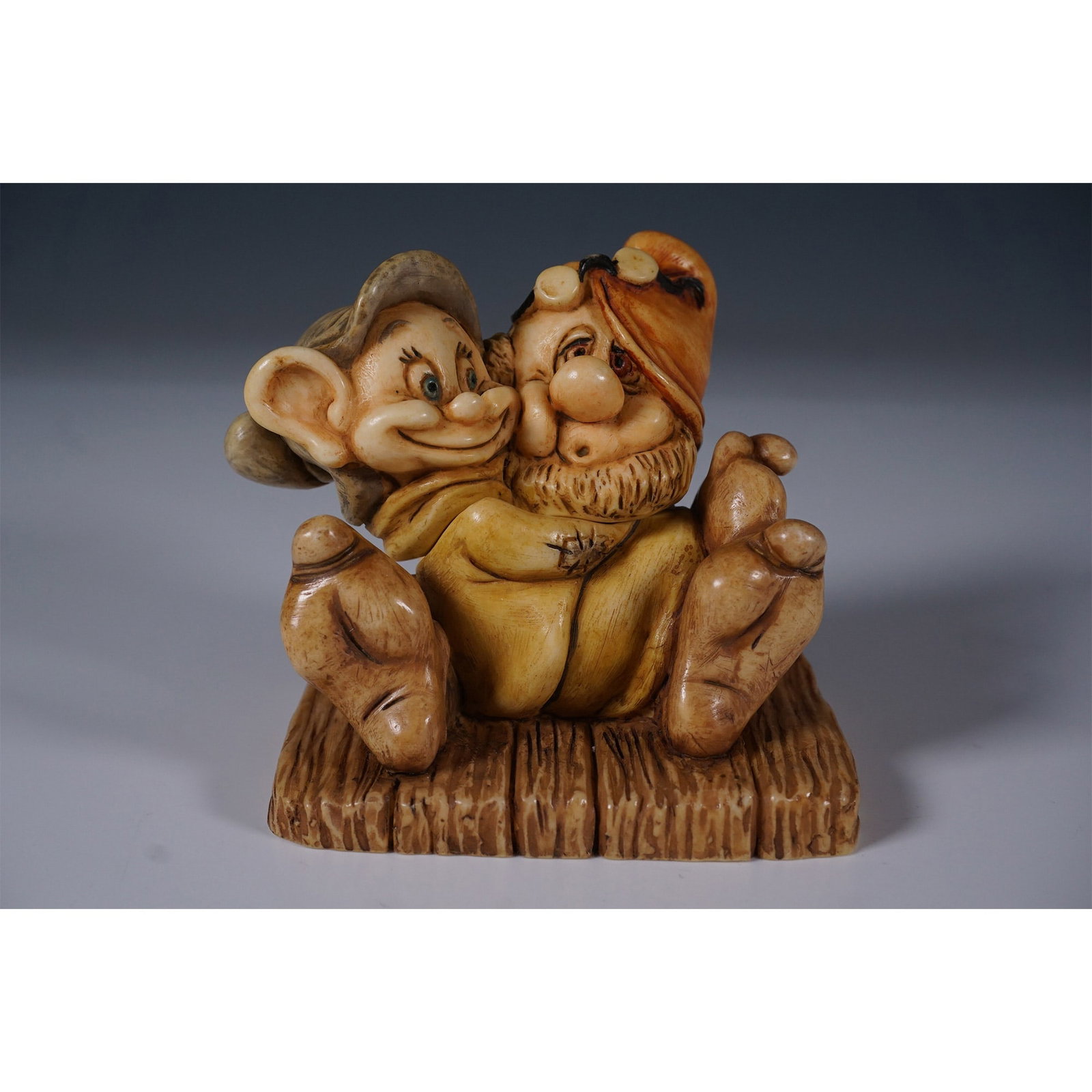 Harmony Kingdom Disney Ltd Ed. Treasure Box, Doc and Dopey: Harmony Kingdom presents this limited edition Disney Treasure Box featuring Doc and Dopey from Snow White and the Seven Dwarfs. This intricately sculpted box figurine captures the duo in a playful pos
