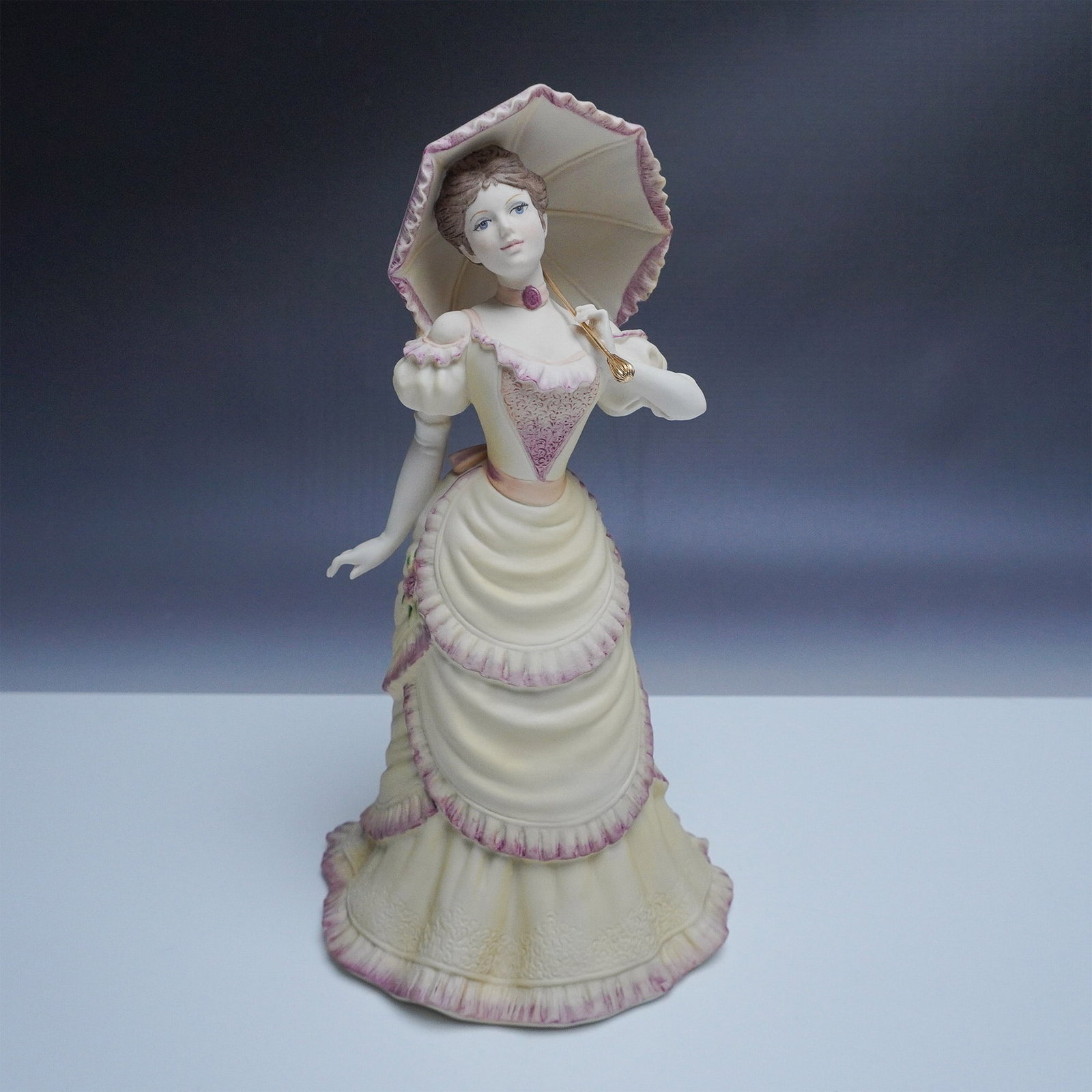 Coalport Age of Elegance Chiswick Walk Figurine: This exquisite Coalport fine bone china figurine, titled Chiswick Walk, is part of the Age of Elegance collection. Hand-decorated and modelled by renowned artist David Lyttleton, this piece showcases 