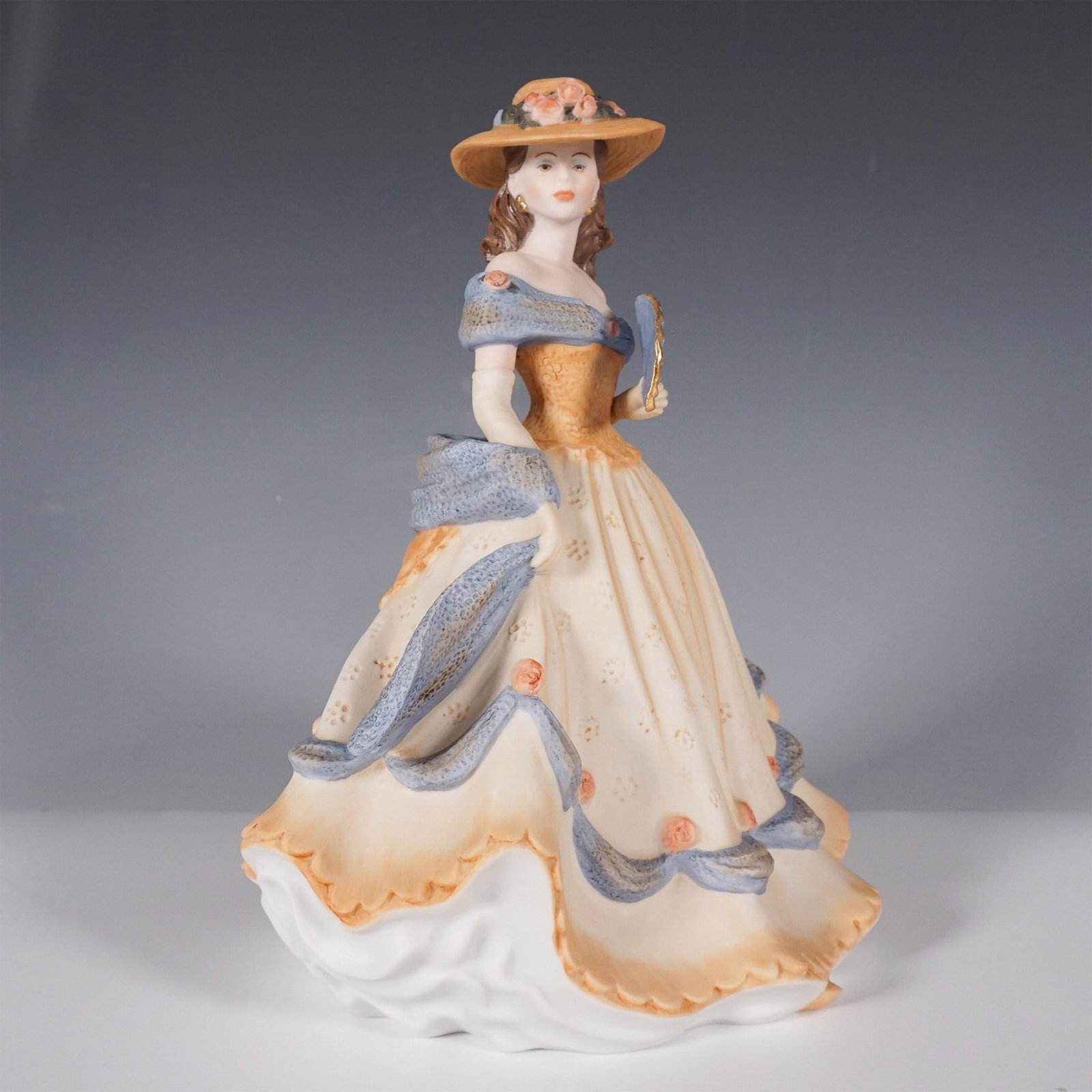 Coalport Age of Elegance Spanish Serenade Figurine: A Coalport Age of Elegance figurine titled Spanish Serenade, crafted in fine English porcelain and hand-decorated in 1993. This elegant figurine captures a refined lady in a flowing gown adorned with 