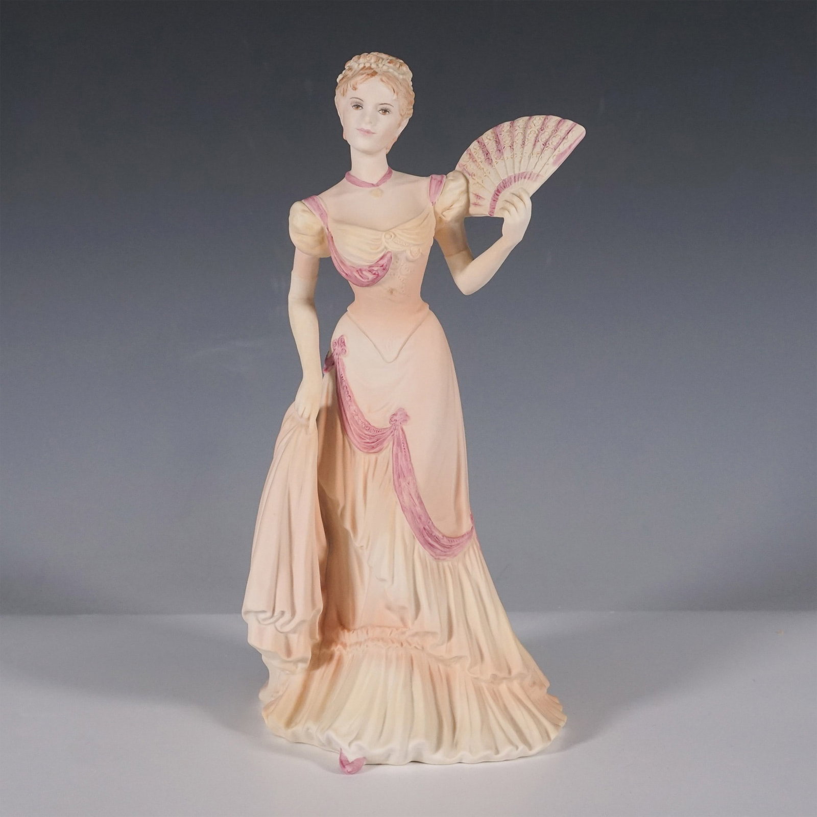 Coalport Porcelain Figurine, Evening at the Opera: Coalport porcelain figurine titled Evening at the Opera from the Age of Elegance series. Designed by J. Bromley and dated 1994, this finely detailed figurine depicts a gracefully dressed woman in an e