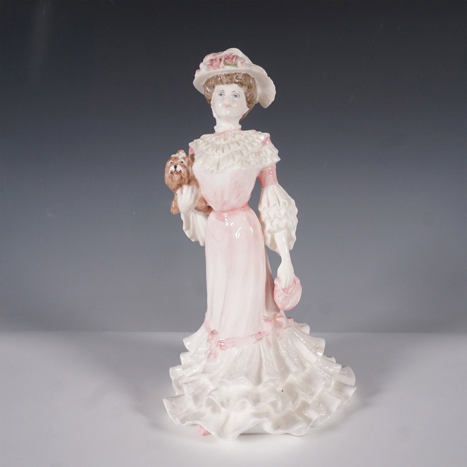 Coalport Golden Age Figurine Georgina, 1989, Limited Edition: A beautifully crafted Coalport bone china figurine titled Georgina from the esteemed Golden Age collection. Inspired by the elegance of the Edwardian era, this refined figure depicts a fashionable lad