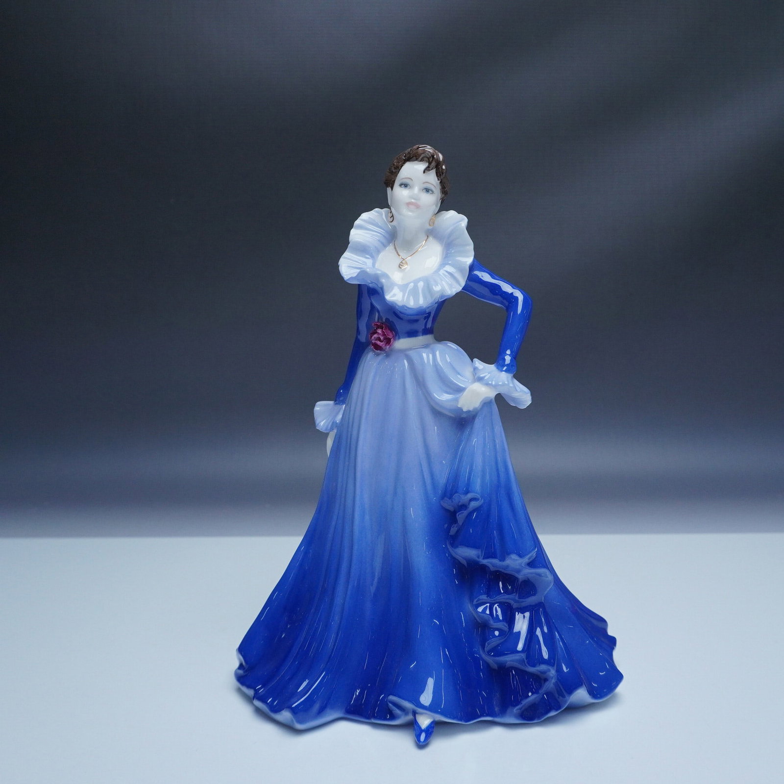Coalport Ladies of Fashion Anne Figurine of the Year 1997: A stunning Coalport bone china figurine titled Anne, part of the Ladies of Fashion collection and designated as the Figurine of the Year 1997. Designed and modeled by Jack Glynn, this hand-decorated p