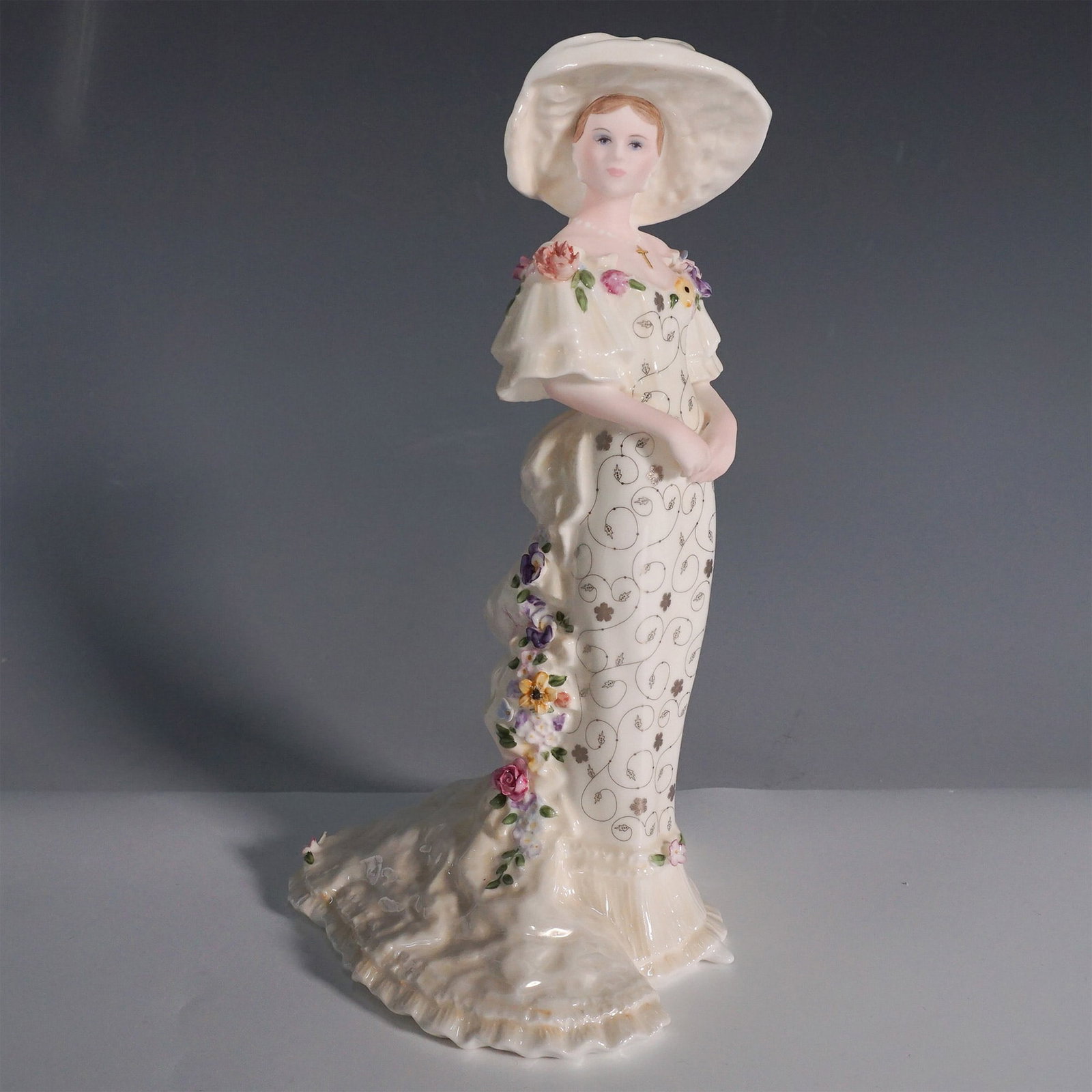 Coalport The Lovely Lady Christabel Figurine: This Coalport bone china figurine, titled The Lovely Lady Christabel, is part of The Basia Zarzycka Collection. Designed by the renowned Basia Zarzycka, this limited-edition piece is number 74 out of 