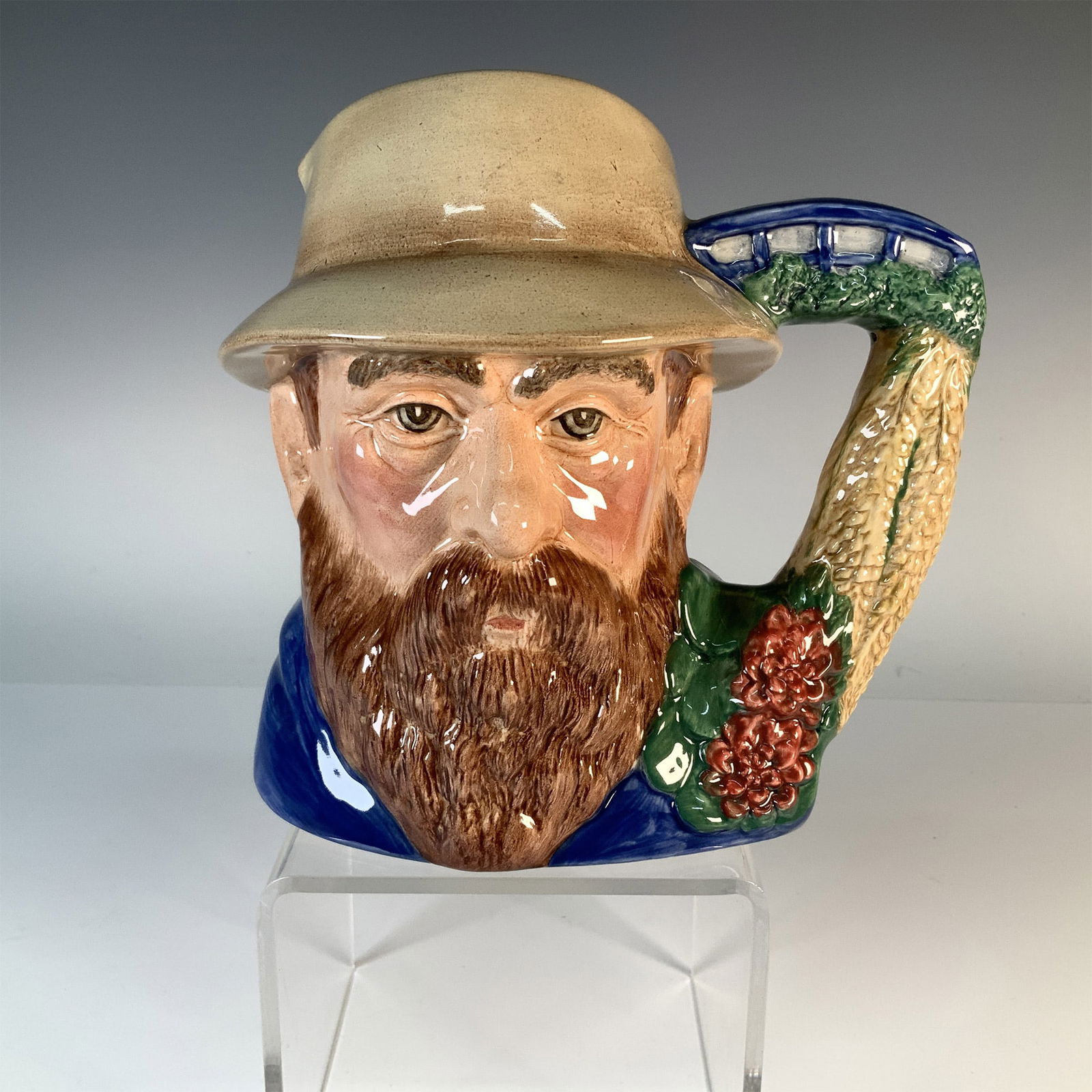 Claude Monet D7150 - Large - Royal Doulton Character Jug: This is a Royal Doulton "Famous Artists" series character jug featuring the iconic French Impressionist painter, Claude Monet. Designed by David B. Biggs in 2000, the jug beautifully captures Monet's