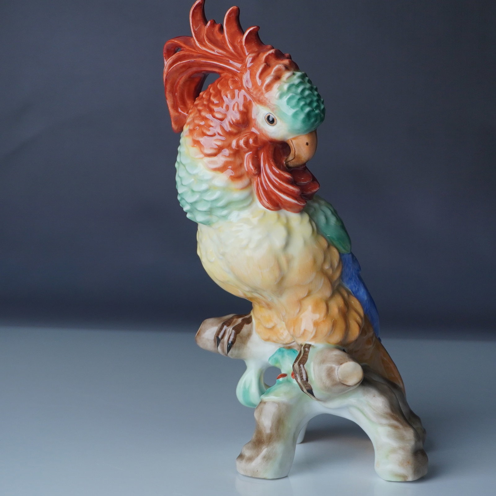 Herend Hungary Hand-Painted Porcelain Cockatoo Figurine: This exquisite Herend Hungary hand-painted porcelain cockatoo figurine captures the elegance and vibrancy of this exotic bird with exceptional artistry. Perched on a sculpted porcelain base, the cocka