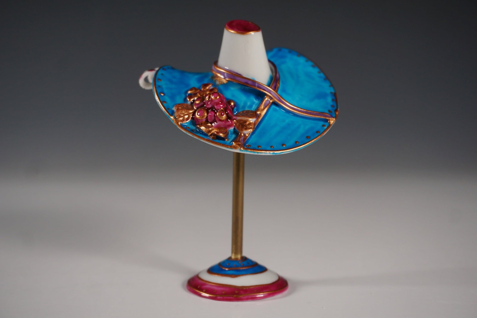 Rochard Limoges France Hand Painted Hat on Stand Figurine: Exquisite Rochard Limoges France hand painted porcelain hat figurine on stand, signed by artist S. Nicole. This finely crafted piece features a vibrant blue hat adorned with intricate gold detailing, 