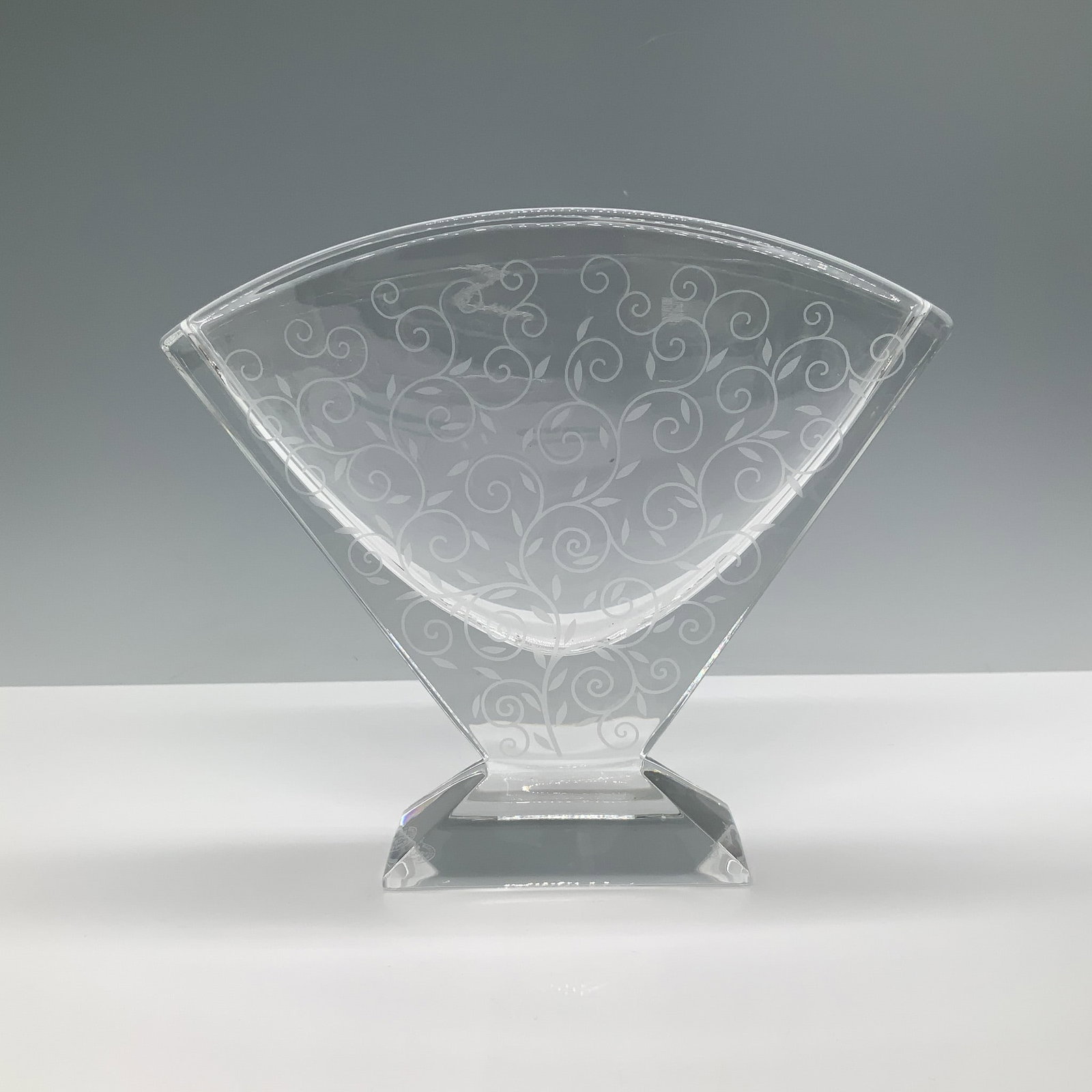 Baccarat Crystal Etched Fan Vase: Baccarat crystal fan vase featuring elegant etched swirl designs on a geometric base. Crafted with Baccarat's renowned craftsmanship, this piece showcases their hallmark clarity and intricate detailin