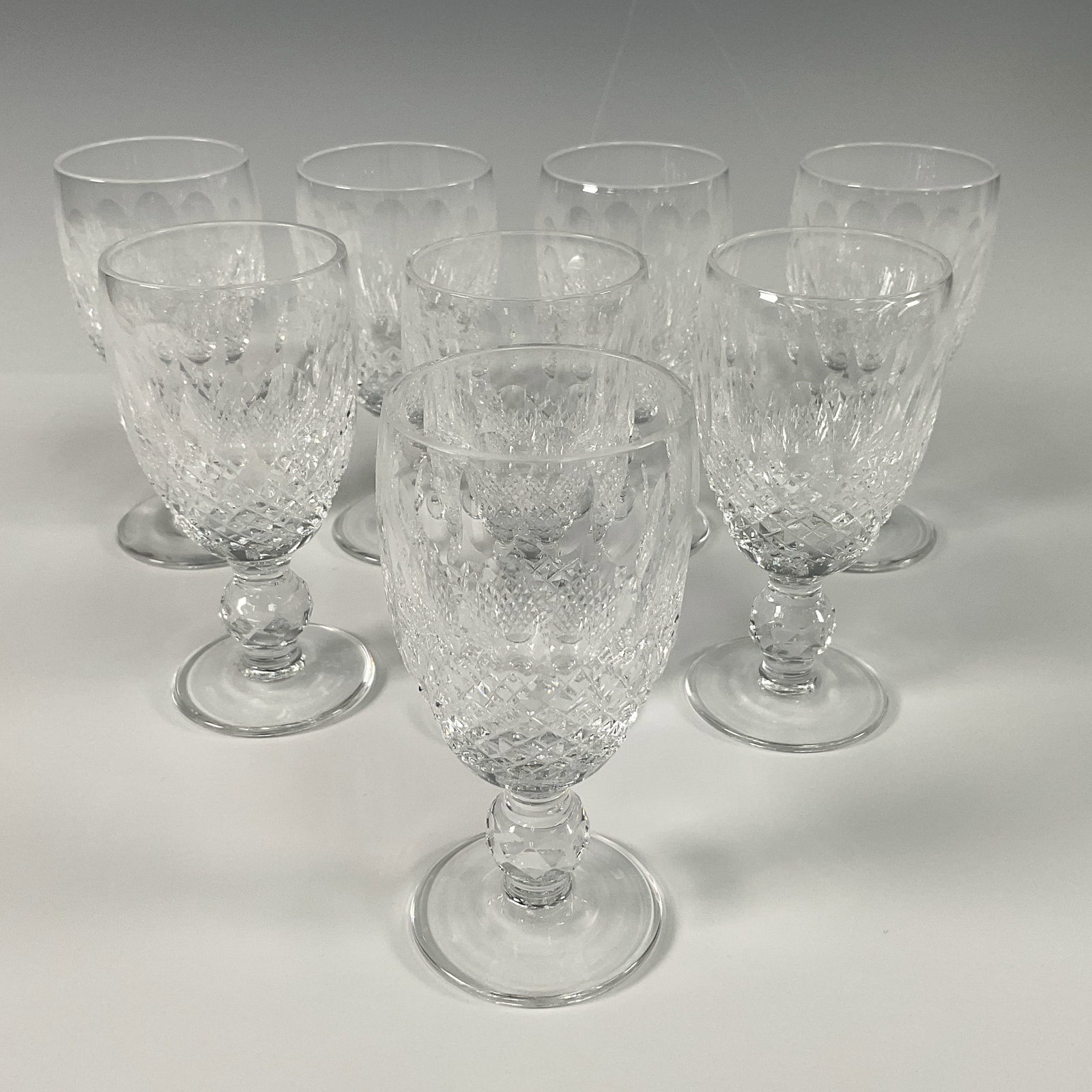 8pc Waterford Crystal Sherry Glasses, Colleen: Exquisite set of 8 Waterford crystal sherry glasses in the iconic Colleen pattern. Featuring oval cut panels and intricate crosshatch detailing, these glasses showcase Waterford's renowned craftsmansh