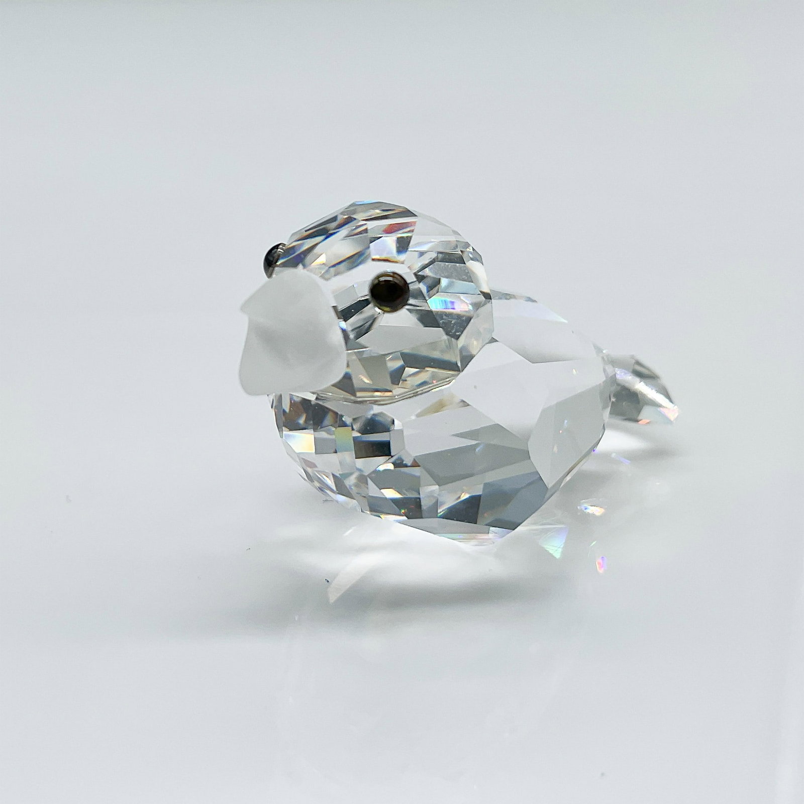 Swarovski Crystal Sparrow Figurine with Original Box: This Swarovski Silver Crystal Sparrow figurine is a stunning example of the brand's precision-cut craftsmanship. The faceted clear crystal body is complemented by a frosted beak and delicate black cry