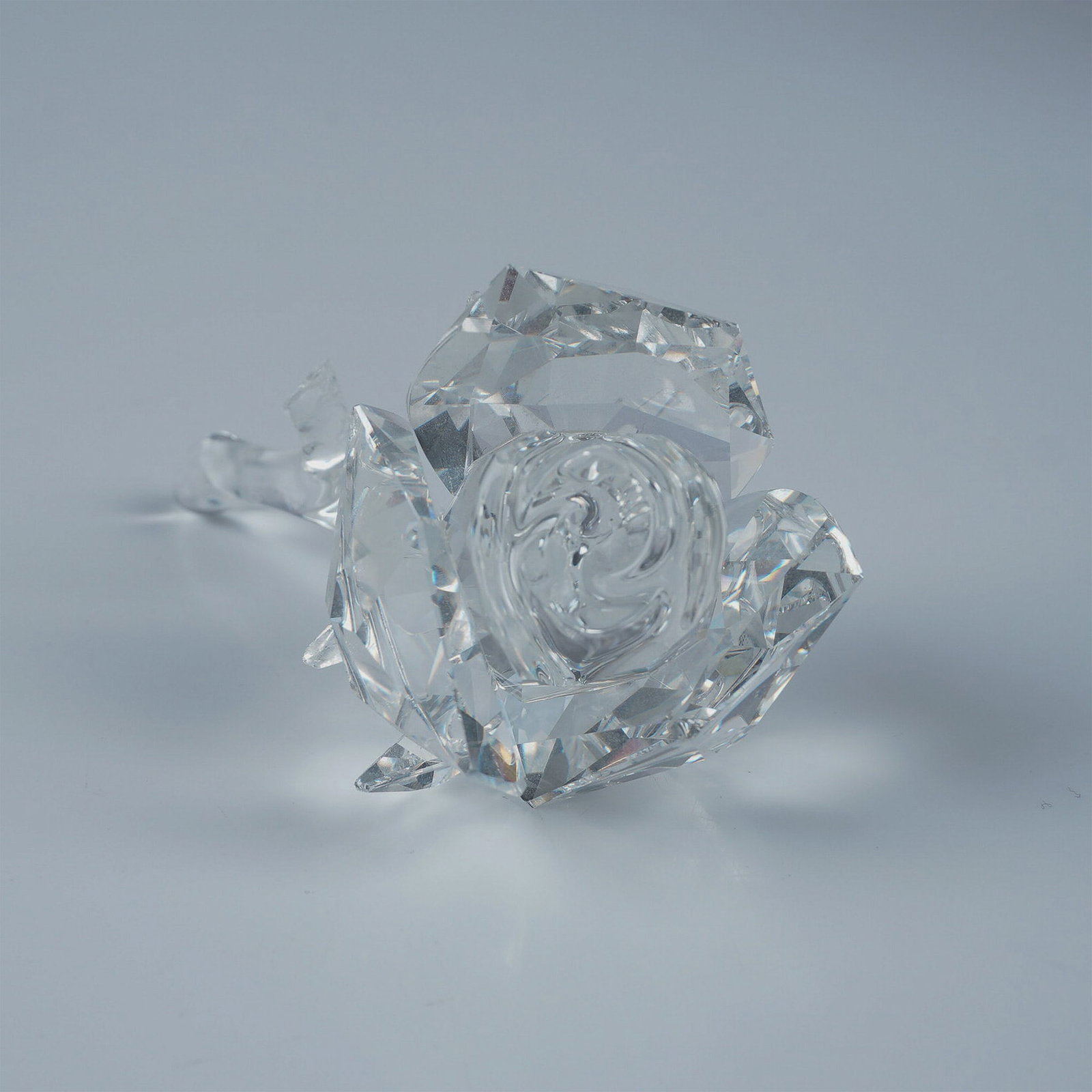 Swarovski Crystal Figurine, Rose with Original Box: This Swarovski crystal figurine features a delicately crafted rose, part of the Exquisite Accents collection before being reclassified under the In the Secret Garden theme. Made from clear faceted cry