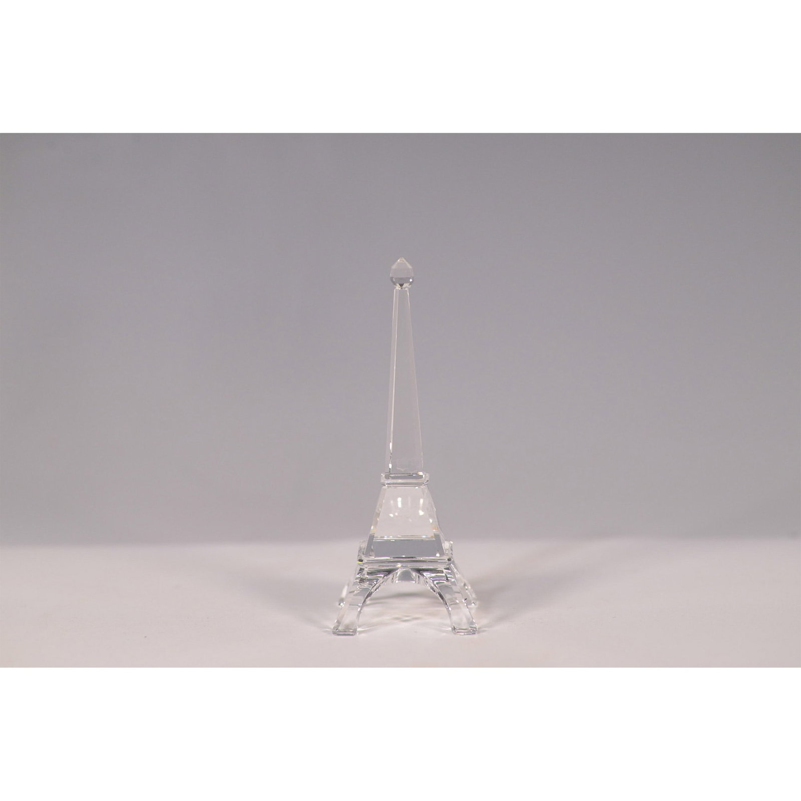Swarovski Crystal Figurine, Eiffel Tower 5682077: Elegant Swarovski crystal figurine depicting the iconic Eiffel Tower. Originally introduced exclusively in France in 2014, this piece was later released globally in 2017 as part of the Travel Memories