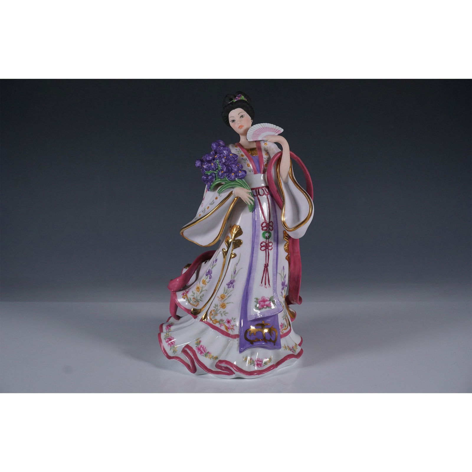 Lena Liu Porcelain Figurine, Iris Princess: This exquisite porcelain figurine, Iris Princess, is part of The Danbury Mint collection and designed by renowned artist Lena Liu. Featuring intricate hand-painted details, delicate floral motifs, and