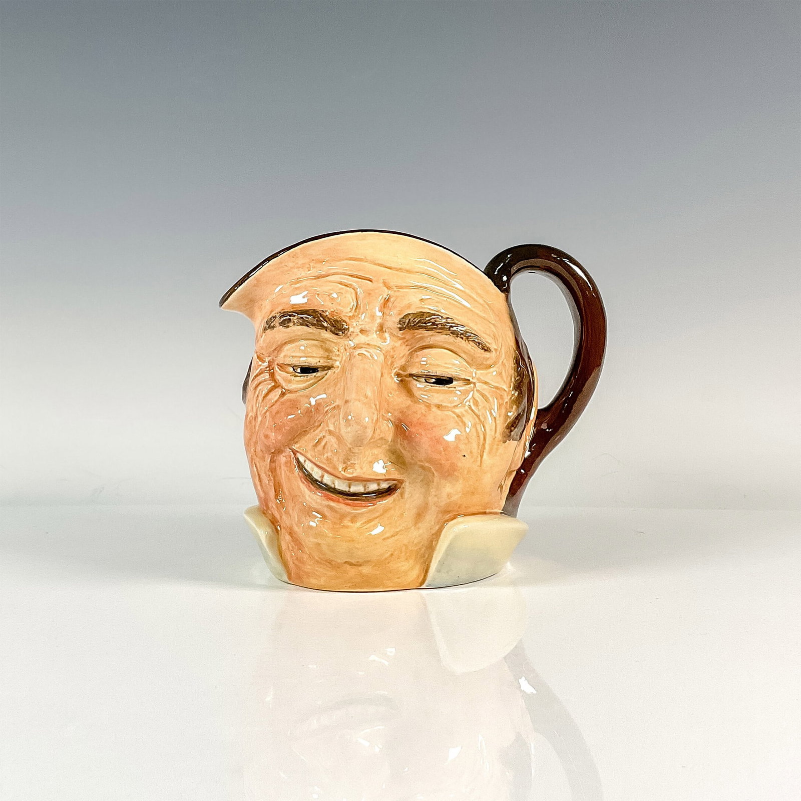 Farmer John D5788 Large Doulton Character Jug: Style One: Handle inside. Brown coloration. Royal Doulton backstamp. Artist: Charles J. Noke Issued: 1938 - unknown Dimensions: 6.5"H Country of Origin: England
