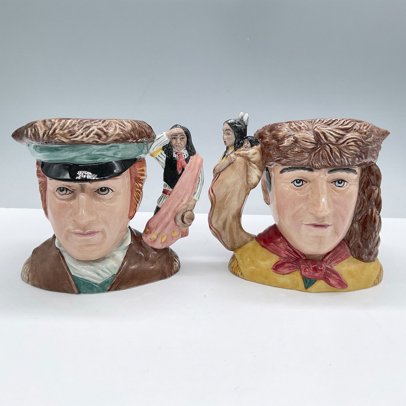 Meriwether Lewis & William Clark Doulton Jug: Set includes: Meriwether Lewis (brown, yellow, red, beige, and black) and William Clark (brown, blue, black, pink, and red). Royal Doulton backstamp. Artist: Caroline Dadd Issued: 2005 Dimensions: 5"H