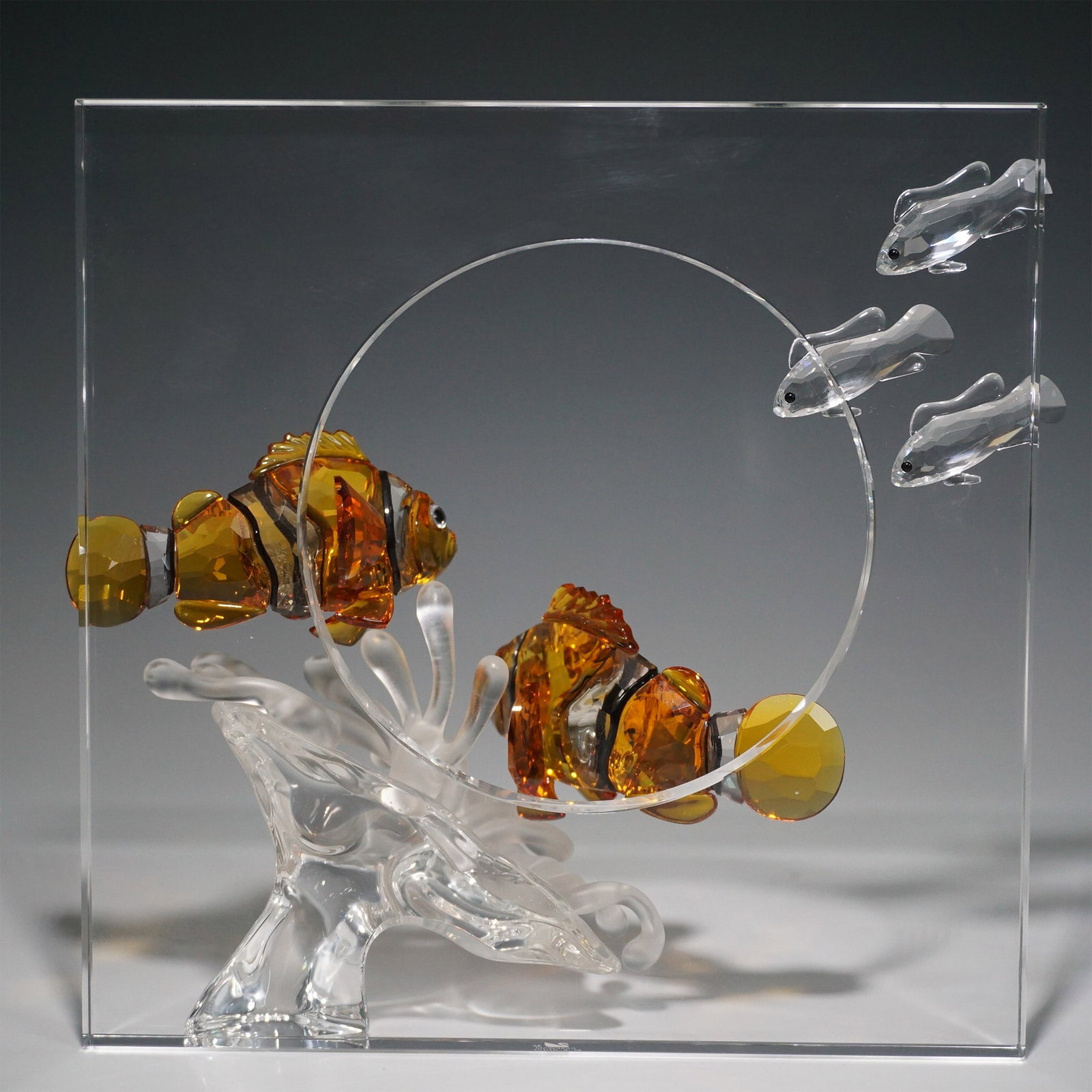 Swarovski Crystal Wonders of the Sea Harmony with Plaque: Swarovski 2005 Annual Edition Harmony, the first installment of the Wonders of the Sea trilogy, designed by Martin Zendron. This Harmony figurine features a school of fish in the top left corner and t
