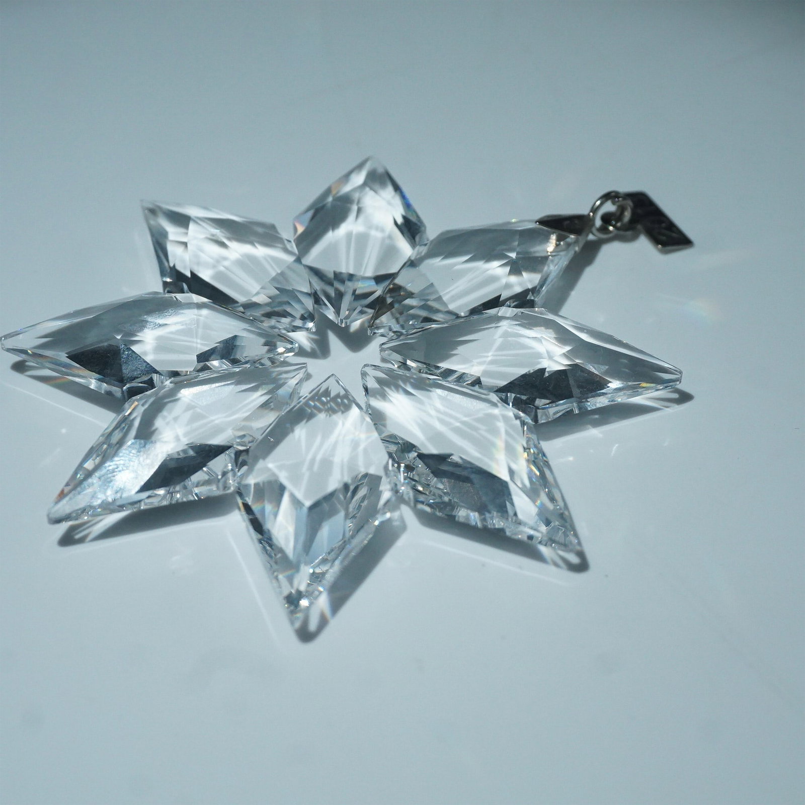 Swarovski Crystal Ornament, 2013 Christmas Snowflake: This Swarovski 2013 Christmas Ornament is a dazzling, multi-faceted crystal snowflake that reflects light beautifully. Measuring 3.25" in diameter, this limited-edition piece features a metal tag engr
