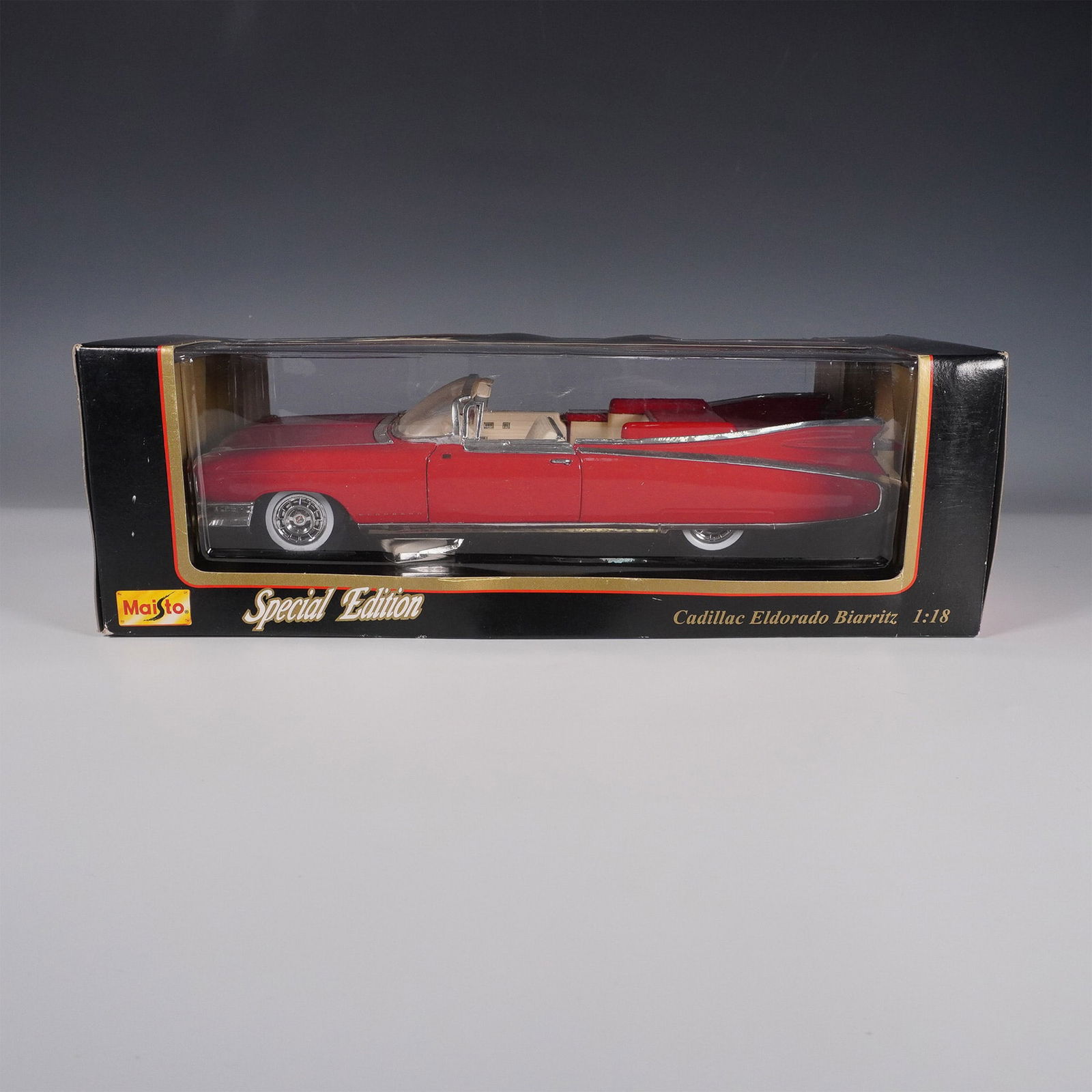 Maisto 1:18 Cadillac Eldorado Biarritz Diecast Model: This Maisto Special Edition diecast model replicates the classic Cadillac Eldorado Biarritz in a 1:18 scale, featuring a striking red exterior with a tan interior. The detailed model includes opening