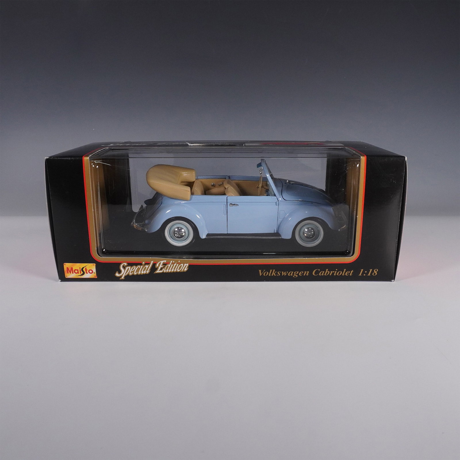 Maisto 1:18 Volkswagen Cabriolet Die Cast Model Car: Maisto Special Edition 1:18 scale die cast model of the 1951 Volkswagen Cabriolet featuring a finely detailed light blue exterior with a tan interior. This precision crafted model includes an opening 