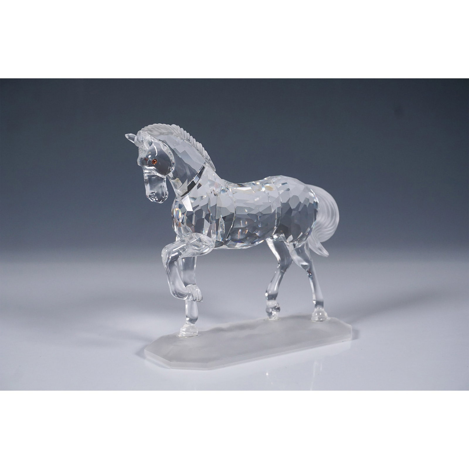 Swarovski Crystal Arabian Stallion Figurine: Elegant Swarovski Crystal Arabian Stallion figurine, model number 221609. Designed by Martin Zendron, this magnificent piece showcases the powerful yet graceful stance of the Arabian breed, captured i