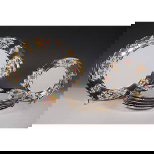 7pc Noritake Fine China Floral and Gilt Plate Set: Elegant Noritake 7-piece fine china plate set featuring a floral and gilt design. The set includes six smaller plates and one larger double-handled serving plate. The plates showcase a decorative bord