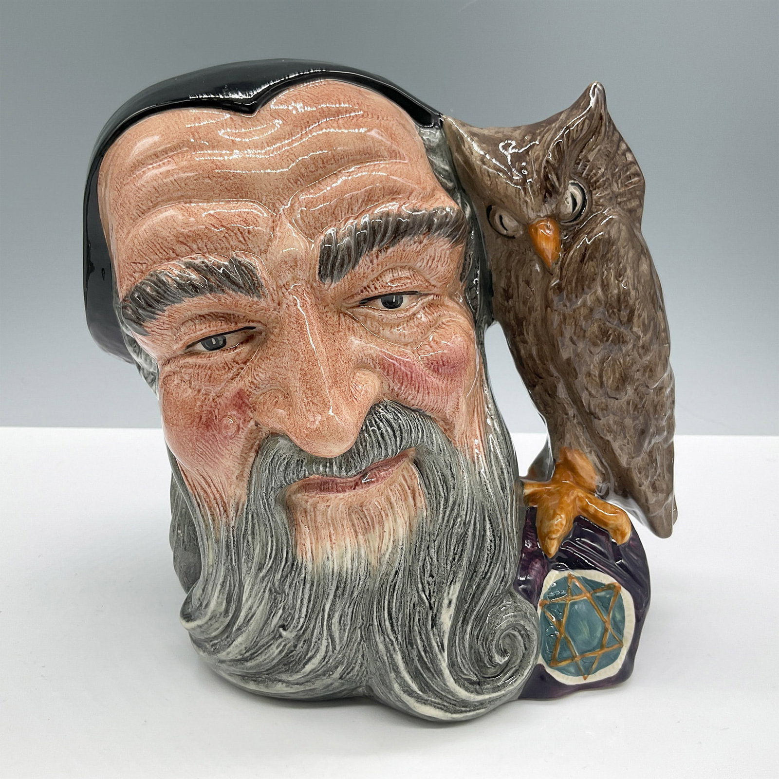 Merlin D6529 - Large - Royal Doulton Character Jug: Black, grey and brown coloration. Royal Doulton backstamp. Artist: Garry Sharpe Issued: 1960 - 1998 Dimensions: 7.25"H Country of Origin: England