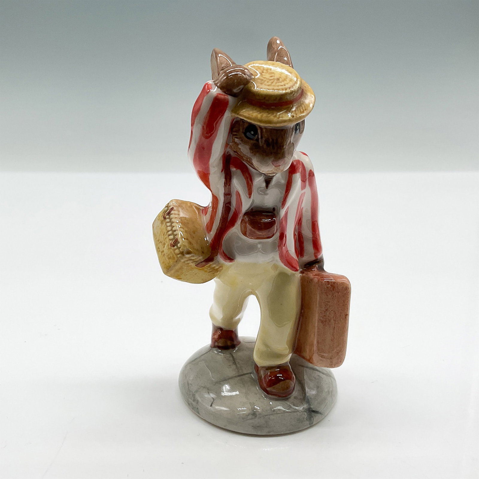 Royal Doulton Bunnykins Figurine, Father Bunnykins DB154: This dapper bunny is from the Bunnykins of the Year series. Designed in a striped red and white blazer and yellow trousers. Signed by Michael Doulton. Royal Doulton Bunnykins backstamp. Artist: M. Alc