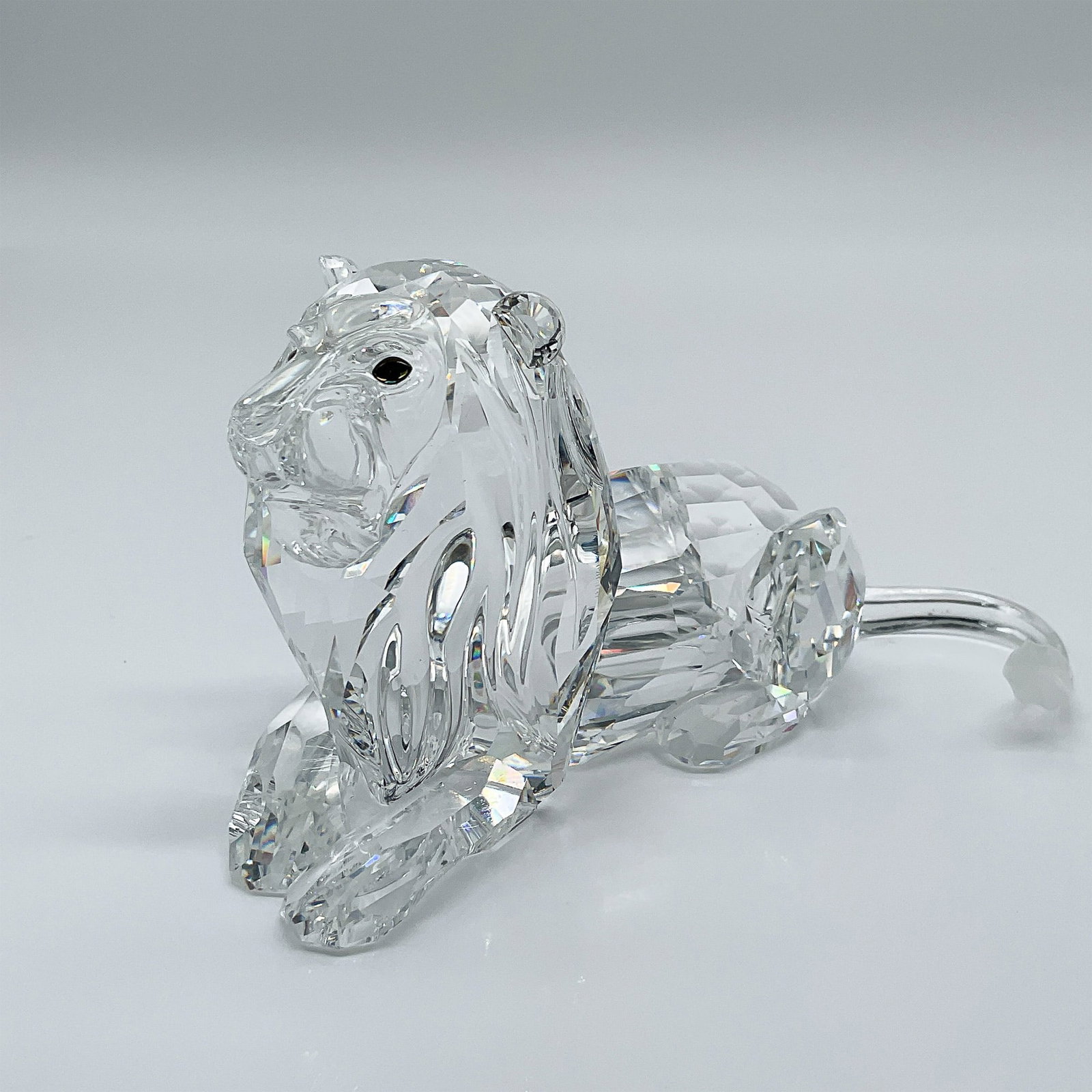 Swarovski Crystal Figurine, Lion 1995 Annual Edition, 185410: This Swarovski crystal lion, from the 1995 Annual Edition, marked the final piece of the ?Inspiration Africa? trilogy. Exclusively available during Swarovski?s centenary year, this striking design by 